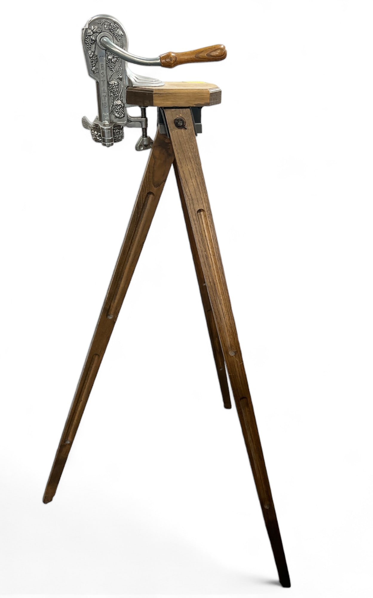 Wine Bottle Opener on a Tripod.: The wine opener is decorated with grapes and stamped, "ESTATE." It has minor scratches, but is in good overall condition. It measures 44" tall when attached to the tripod. By itself, the opener measur