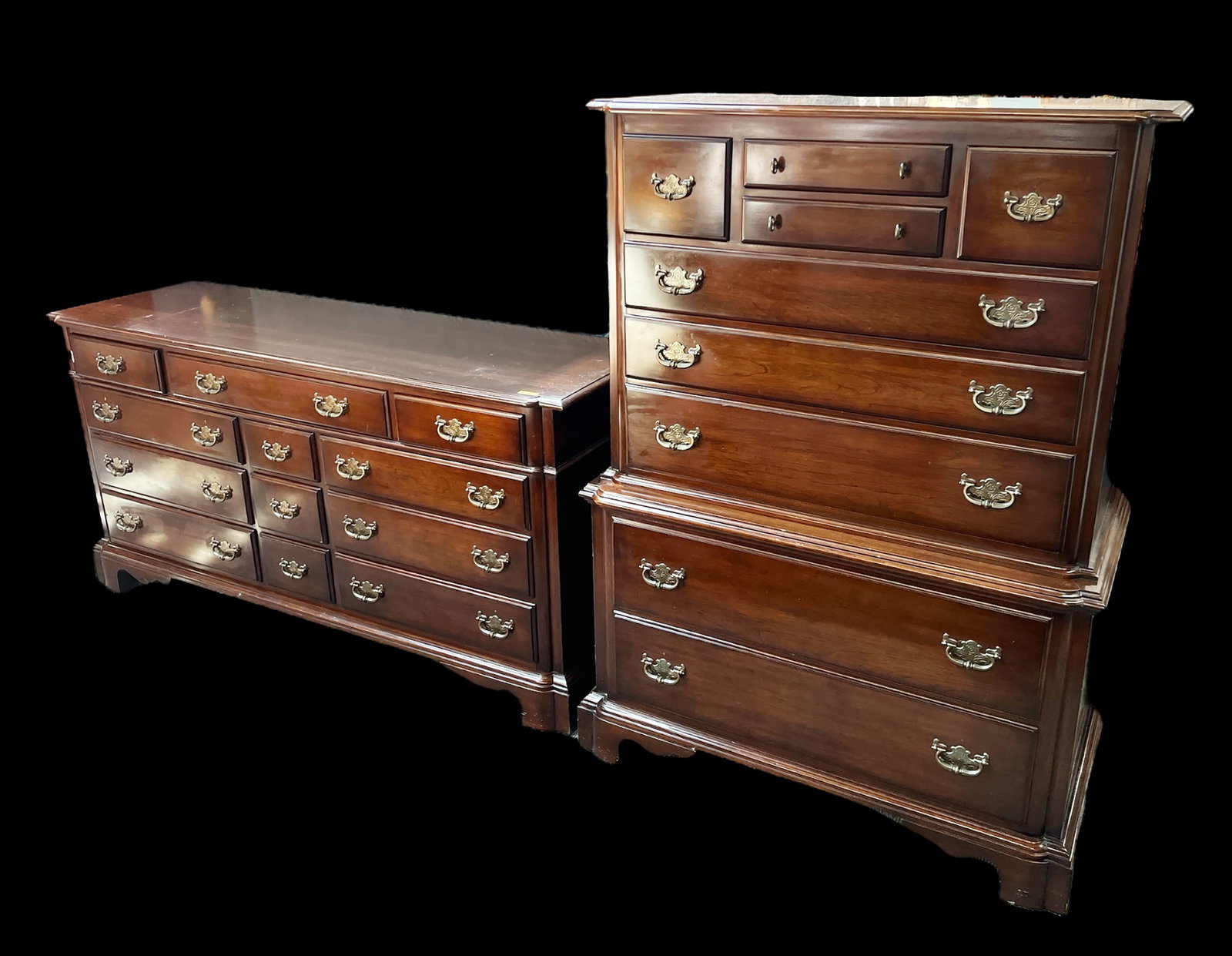Mahogany Low Dresser and Highboy Set.: Both pieces have brass hardware with floral designs, and bracket feet. The low dresser sports a total of twelve drawers, while the highboy has nine. Both pieces are in good condition, with only minor 