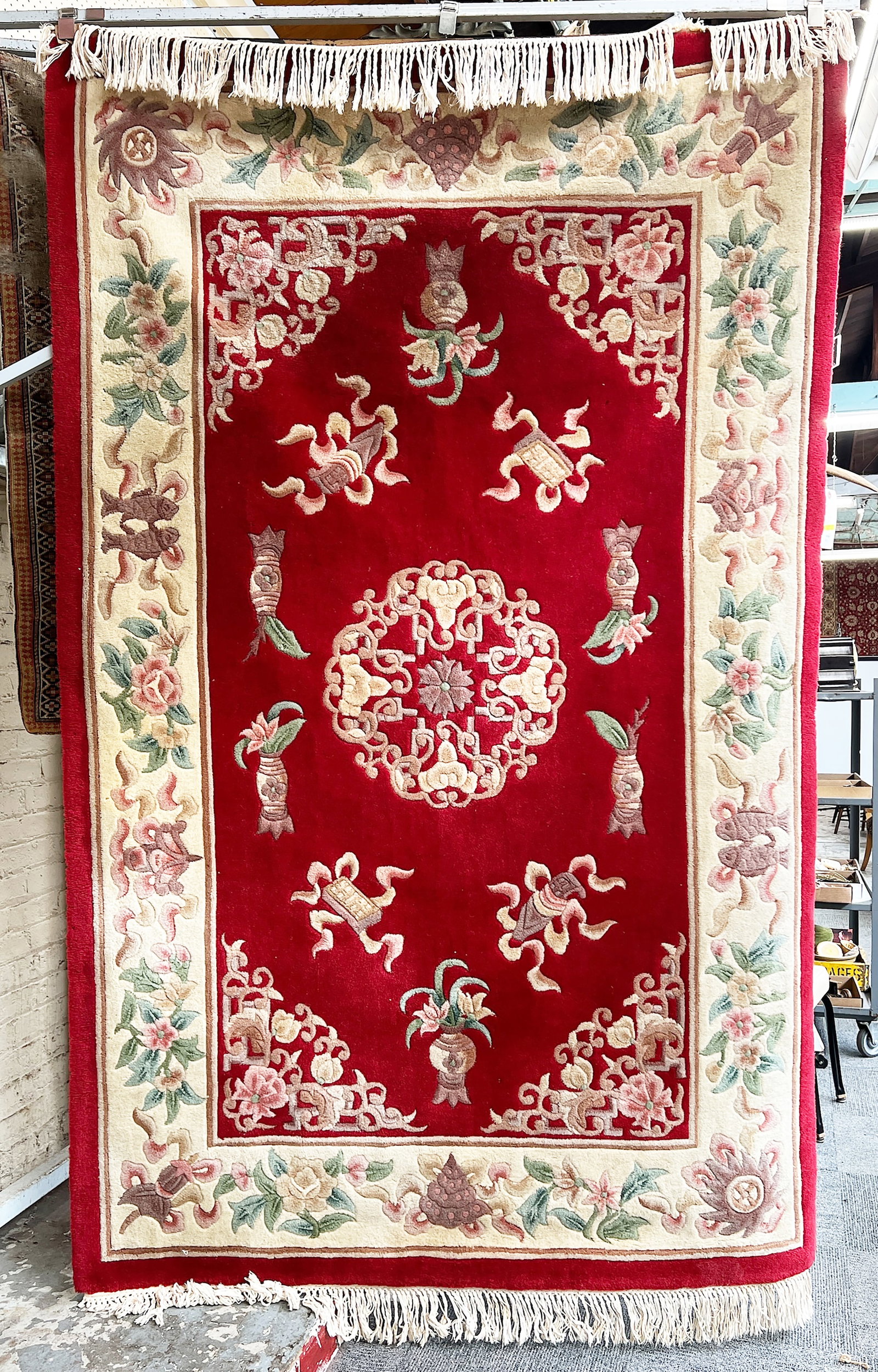 5' 3" x 8' 6" Red Chinese Sculptured Rug.: The Rug has tiny areas of moth damage, which resemble pitting in some spots of the rug. In-house shipping is available for this rug. Please see our website regarding in-house shipping procedures.