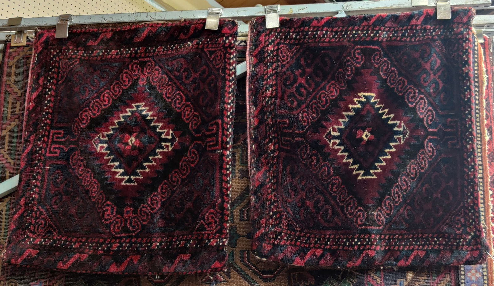 Pair of 1' 8" x 2' 1" Camel Bags.: The bags look to be in good overall condition, with just a bit of fraying. The back of each bag has a plain red cloth backing. In-house shipping is available for these pieces. Please see our website r