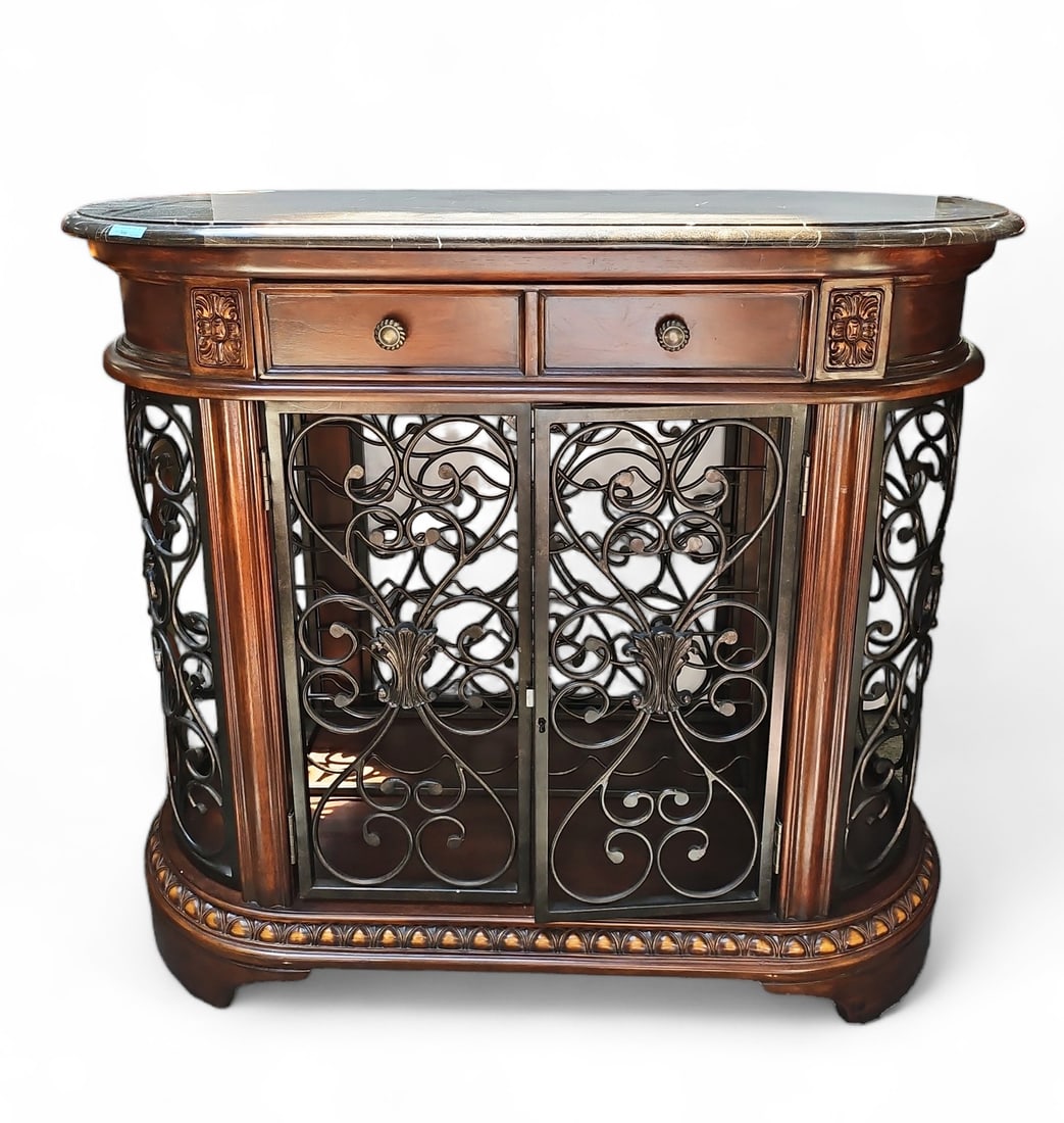 Howard Miller Wine & Spirits Console.: The piece has a marble top, metal grill, removable wine rack (holds 35 bottles), and an upper drawer. It is in good overall condition. It measures 42 1/2" wide, 20" deep, and 37" tall. Third-party fre