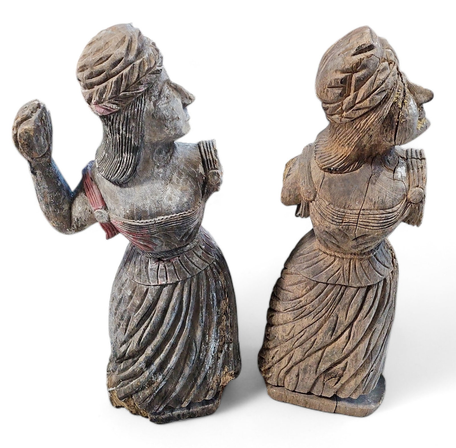 Two Folk Art Style Wooden Maiden Sculptures.: The hand carved women sculptures measure 40 1/2" x 14" x 8 1/2". One is missing one of the arms, and the other is missing both. The pieces have cracks, scratches, and significant chips. Third-party sh