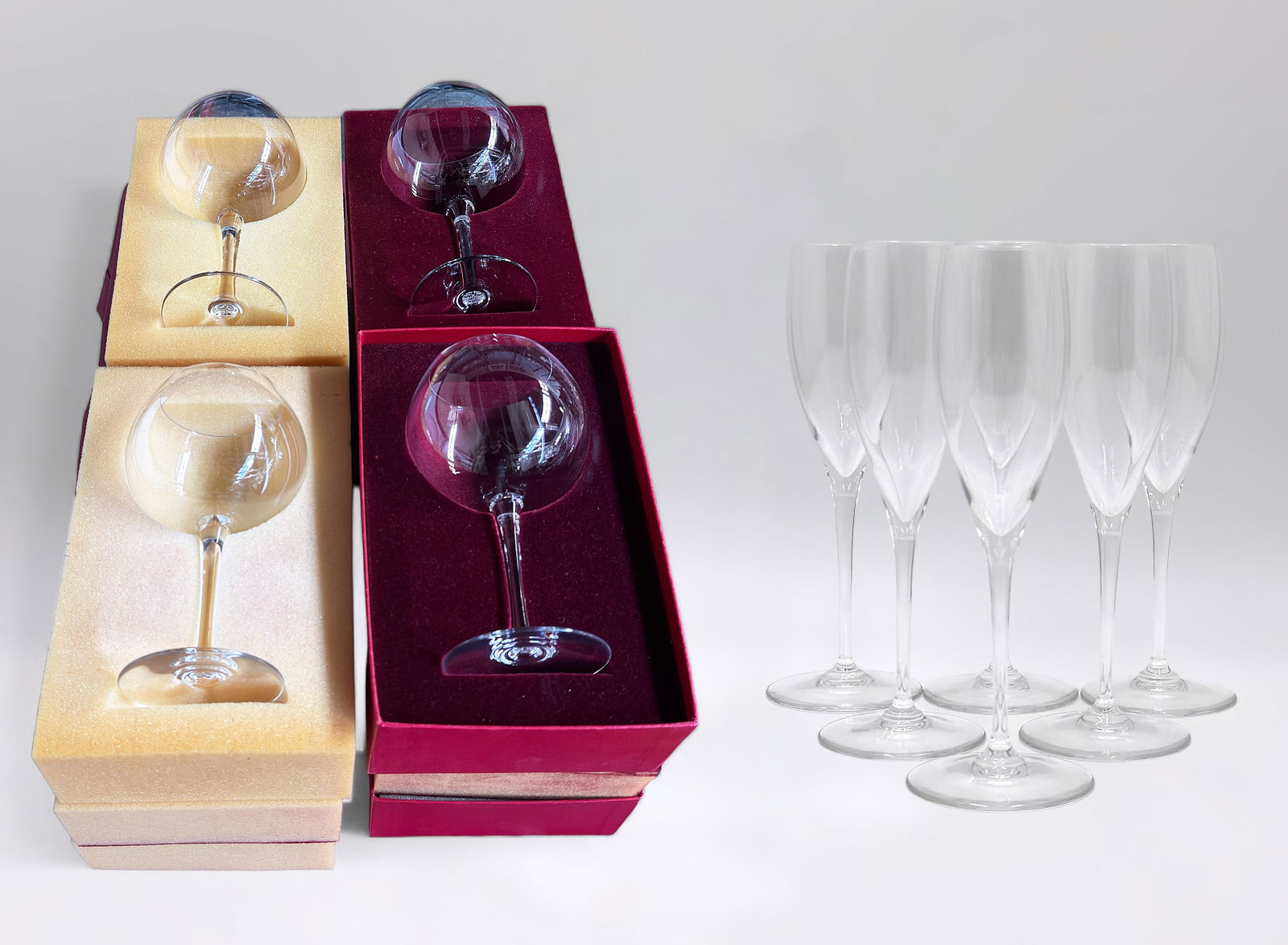 Lot of 14 Baccarat Wine / Champagne Glasses.: This lot includes both red wine goblets and champagne flutes. There are 6 St. Remy Champagne flutes. One of the champagne flutes has a small chip on the rim; the rest of the lot looks to be in nice co