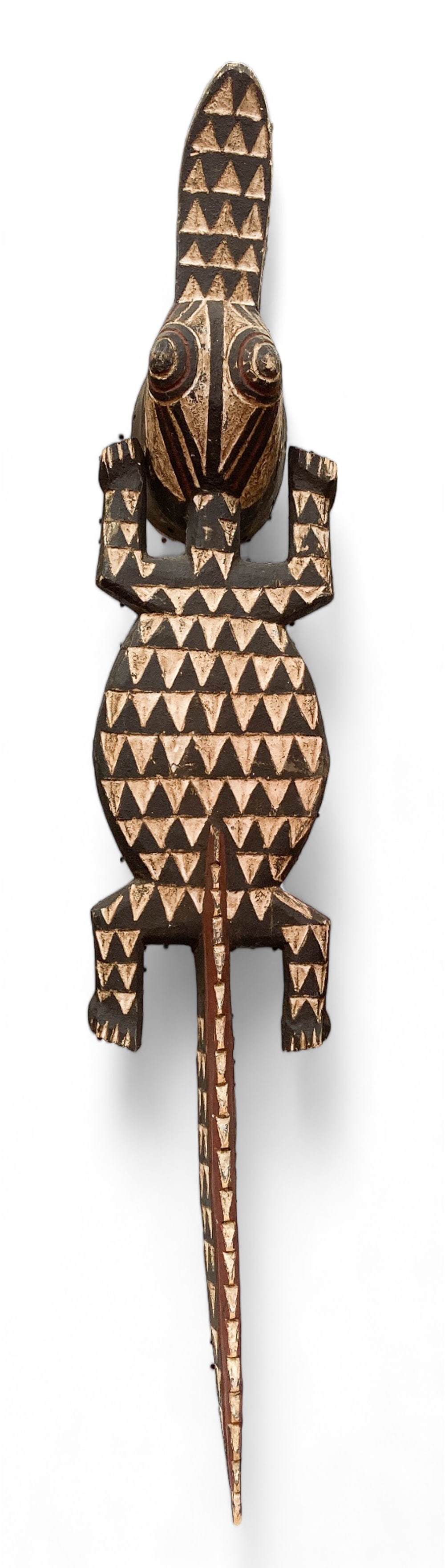 West African Carved Crocodile Mask.: It is a full-body carving of a crocodile with geometric patterns, in good condition. It may be from Burkina Faso or a nearby West African country. The crocodile measures 58" long. Third-party shipping