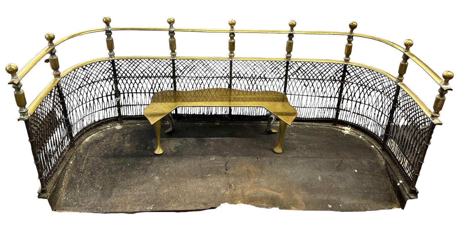 Vintage Brass Fireplace Fender with Stand.: The fender is in good overall vintage condition, with some scratches on the brass, and wear on the metal netting. The fender measures 35" wide, 13" deep, and 15" tall. The stand measures 16" wide, 7 1
