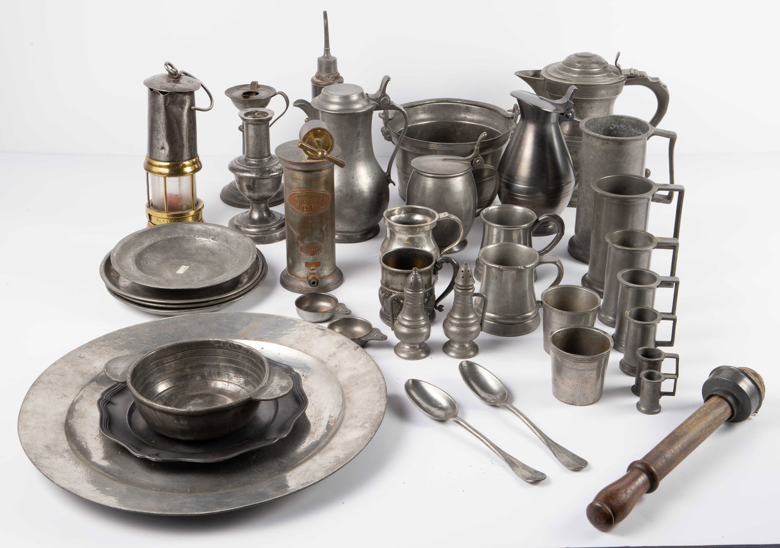Lot of Mostly Pewter Kitchenware - 34 Pieces.: The lot includes a variety of items, many of them signed. First, there are 3 covered jugs, and 7 multi-size steins signed J.R. - next, there are 2 coffee cups with glass bottoms, 1 with a continuous p