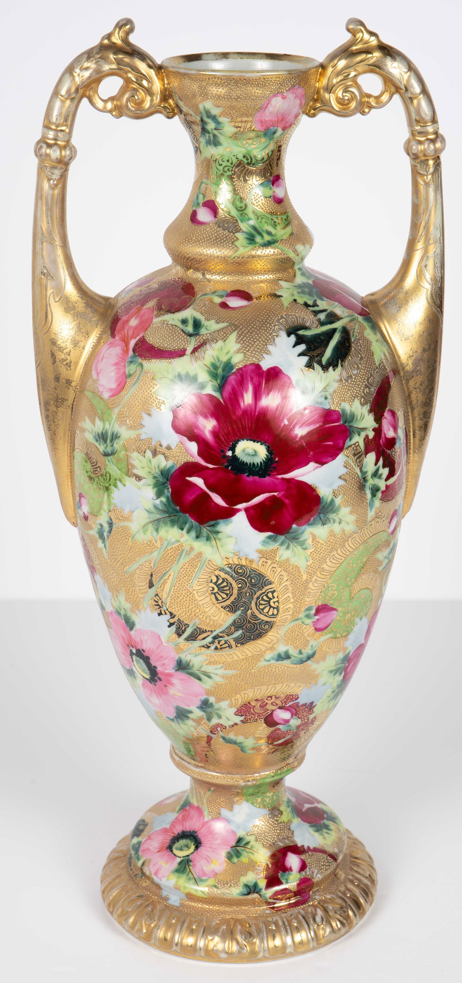 Lg. Sgd. Japanese Porcelain Vase w/ Flower Motif.: There is a small red signature on the underside. There is some paint loss present, most notably on the gold handles. There is also a 1 1/2" strip of plaster or chalk-like material on the exterior. Las