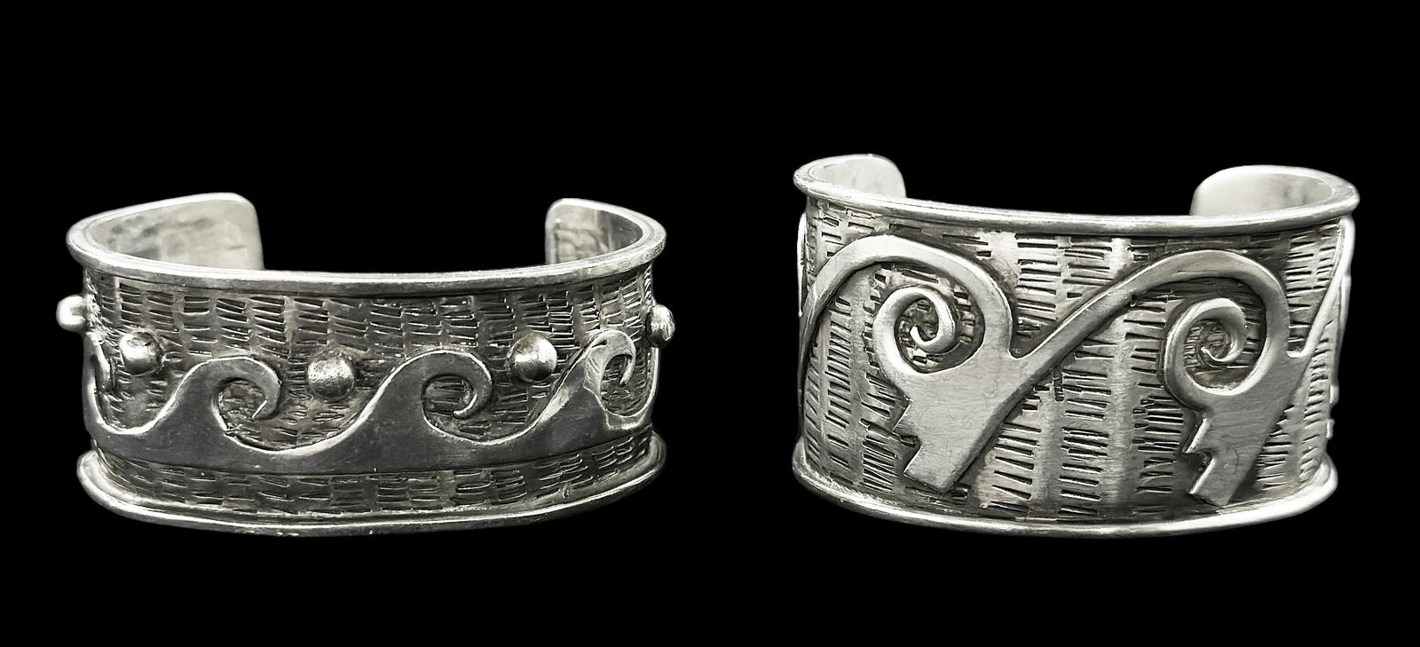 2 Native American Indian Silver Cuff Bracelets.: The makers are unknown. One is marked "Sterling". They measure 15/16" and 1 1/8" wide. The interior widths are 2" and 2 1/8". They weigh a combined 2.82 Troy Ounces.