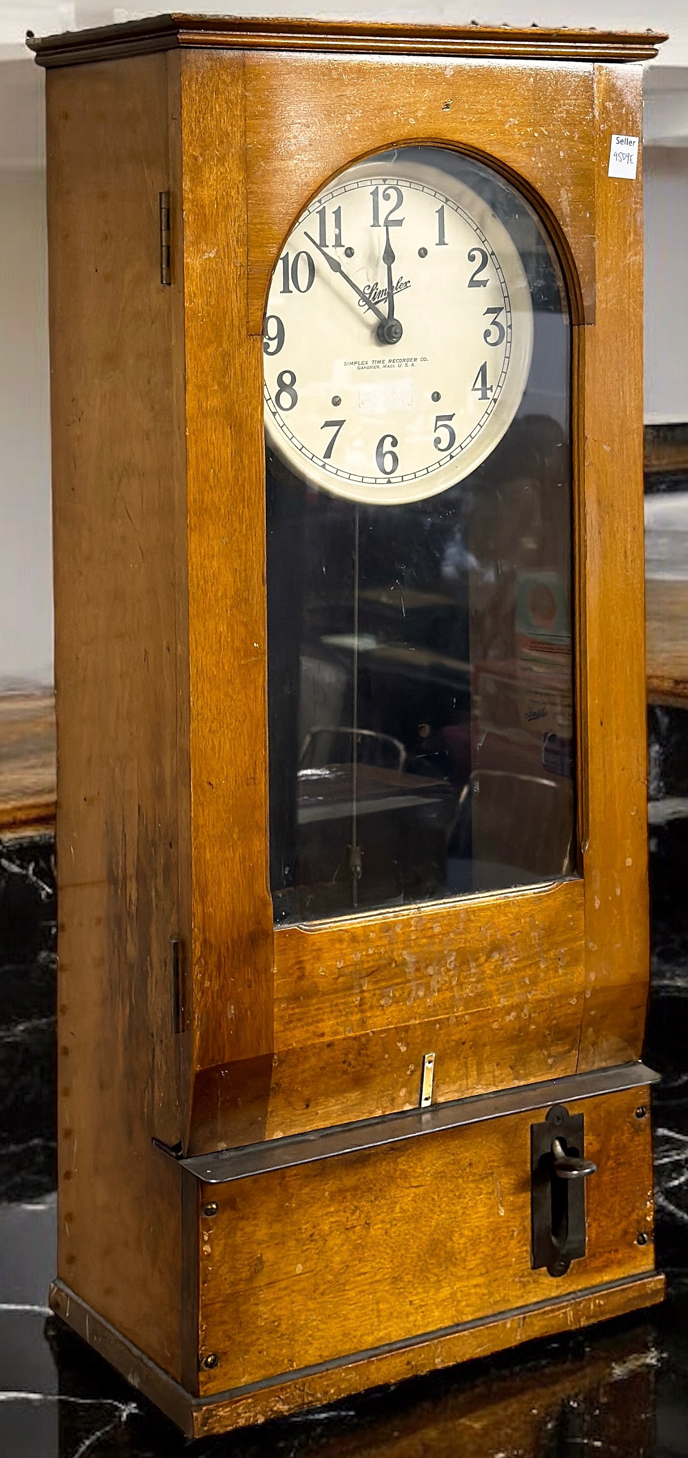 Antique Wood Simplex Wall Time Clock.: The piece has a time stamp mechanism that works. With regards to the clock itself, it is unknown if it works. The clock measures 30 3/4" tall, 12 3/4" wide, and 8 1/4" deep. The key is not included, a