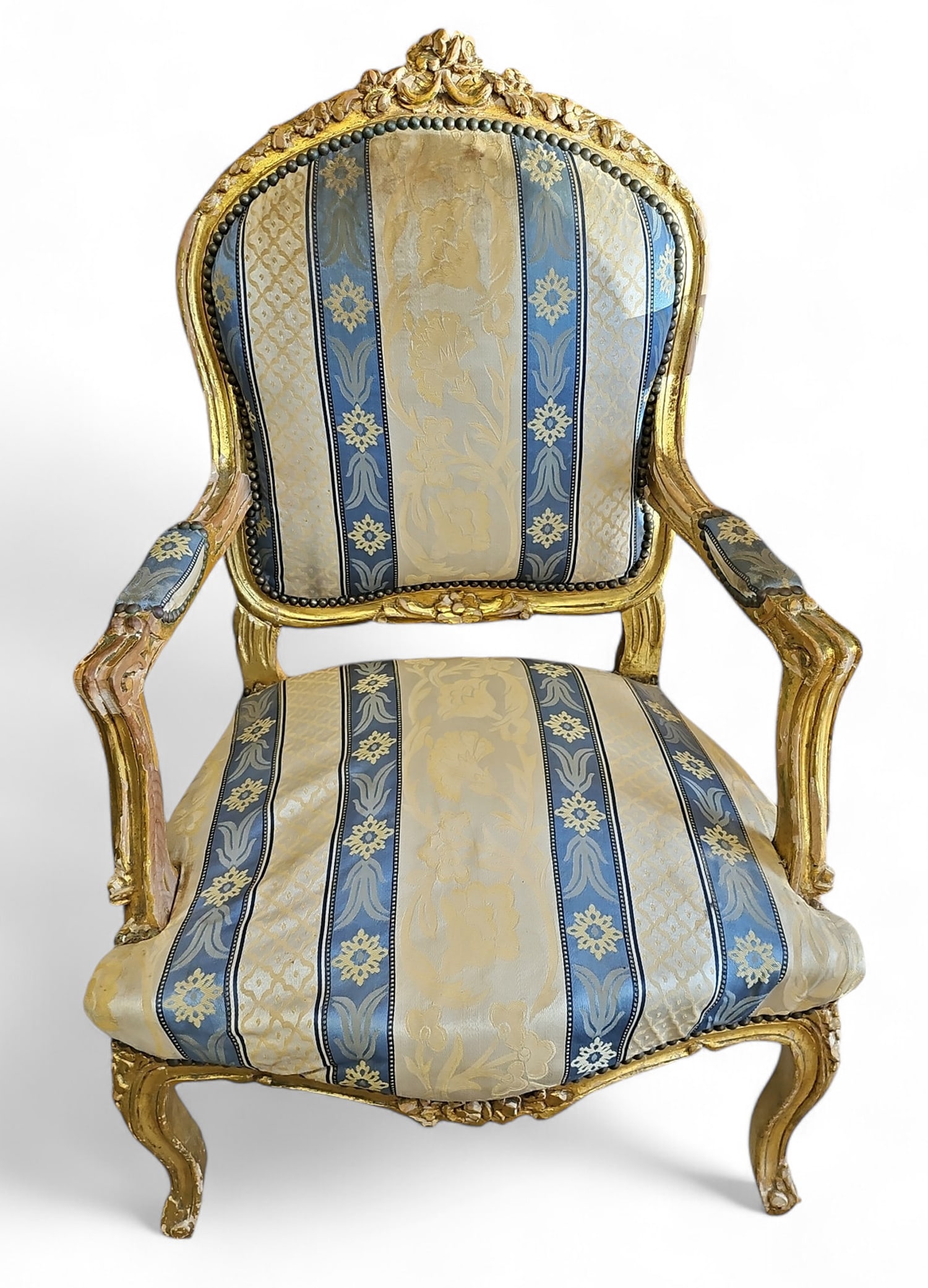 French Style Upholstered Gilt Chair, AS IS.: The chair has striped floral upholstery, nailhead trim, and sits on cabriole legs. The gilding is chipping off all over the place. The seat is very lumpy. The upholstery is worn and dirty in certain a
