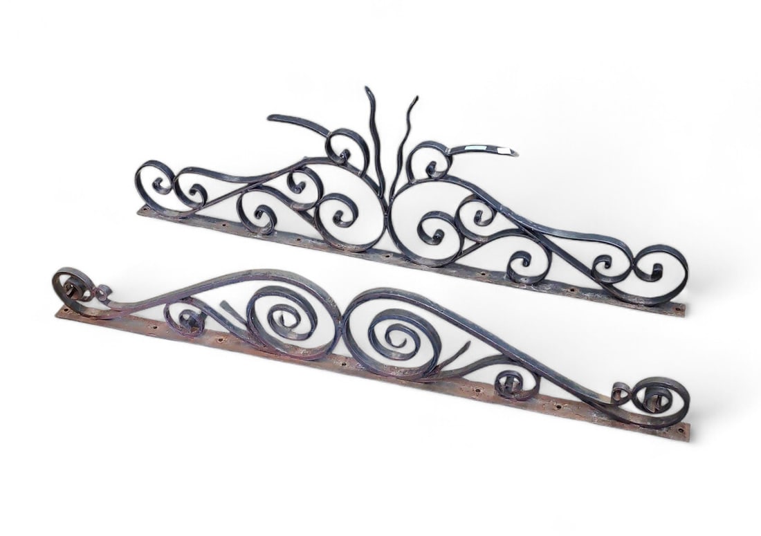 Lot of 2 Wrought Iron Salvage Pediments.: These pediments are made of iron, and one piece is larger than the other. They have holes where they can be attached to a wall. There is some loss of paint, but are overall in good condition. The larg