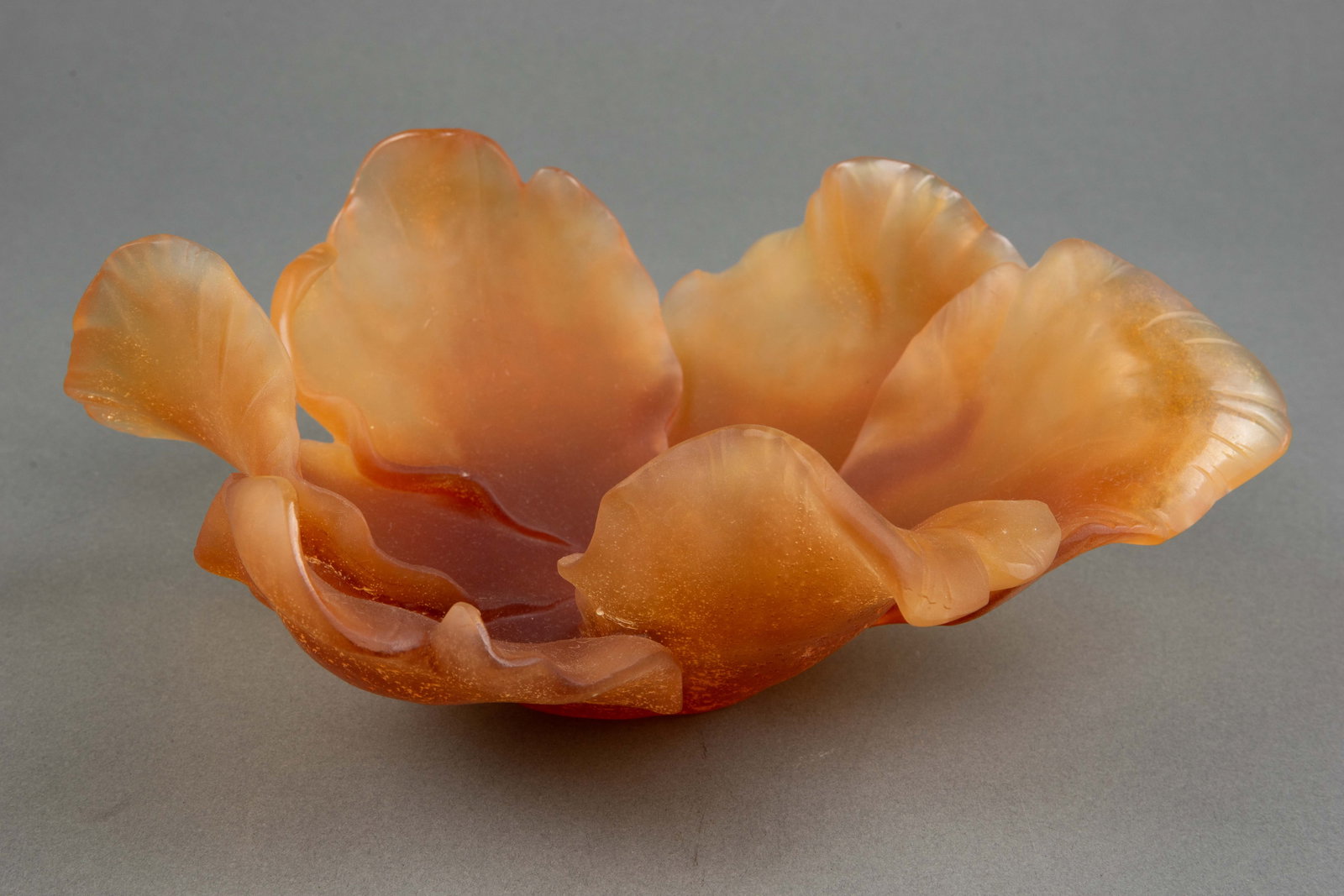 Daum Pate de Verre Amber Tulip Bowl w/ Box.: It is an amber-colored open flower, signed, "Daum France". There are some scratches visible, though it's a little difficult to tell if they are part of the natural texture of the glass. Overall, the p