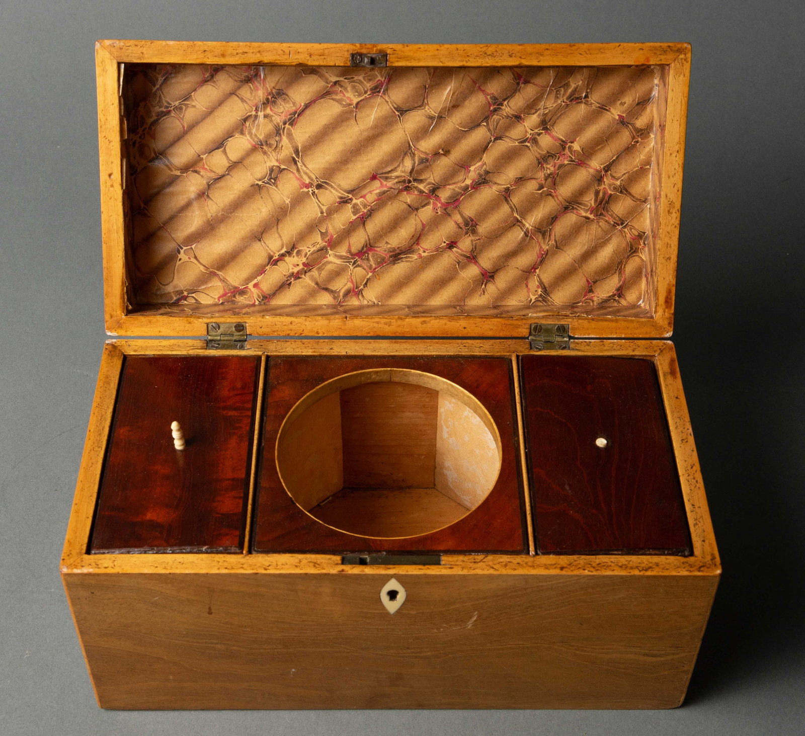 English Light and Dark Wood Fitted Tea Caddy Box.: There is no key included. The caddy has bone inlay around the keyhole, and a bone knob on one of the compartment doors (the other knob has broken off). There are some scratches, cracks, and signs of s