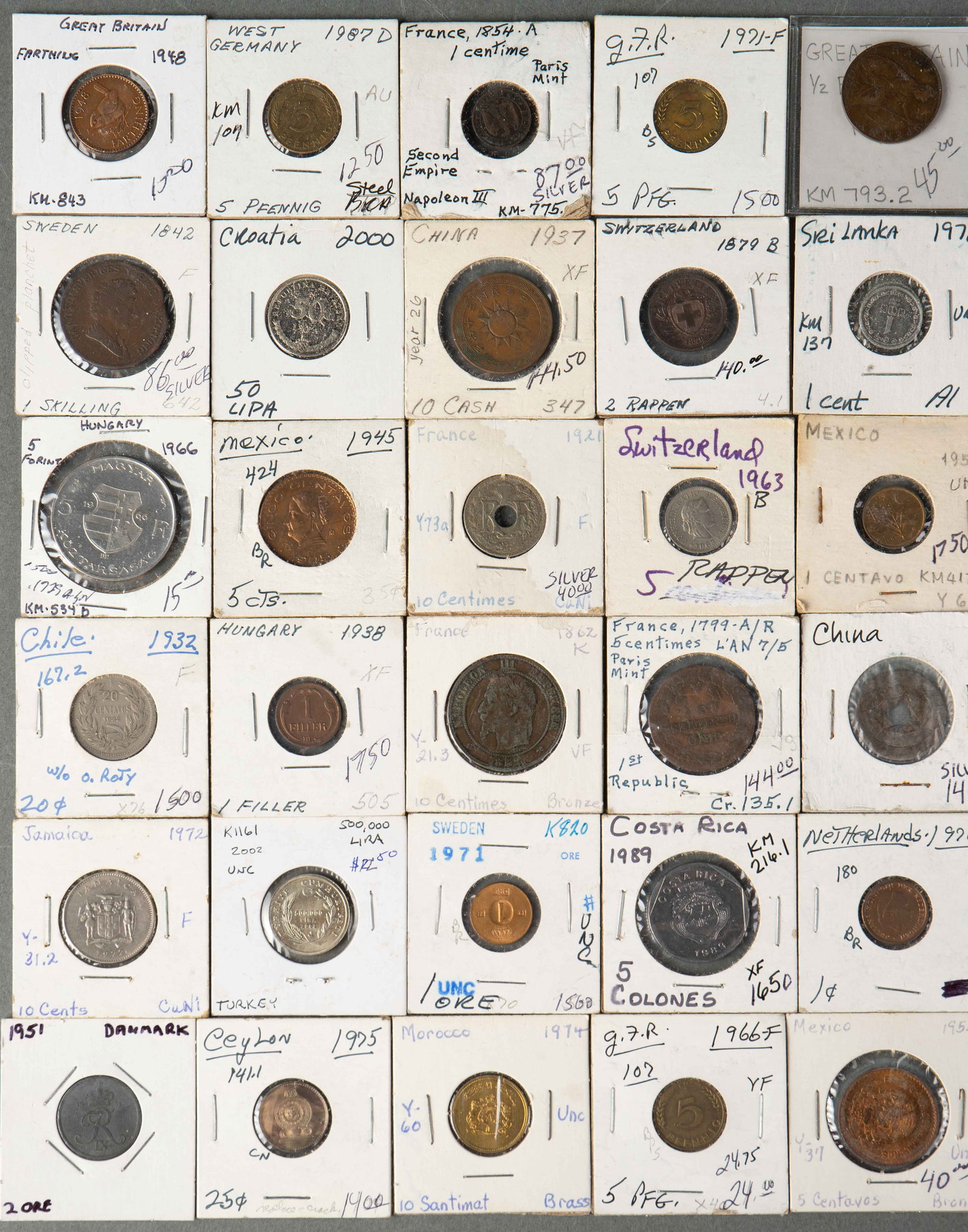 Lot of 30 Antique and Old International Coins.: This lot includes coins from France, Hungary, Chile, West Germany, Jamaica, Morocco, Switzerland, Mexico, Croatia, the Netherlands, China, and more. The oldest coin in the lot is a 5 Centimes coin fro