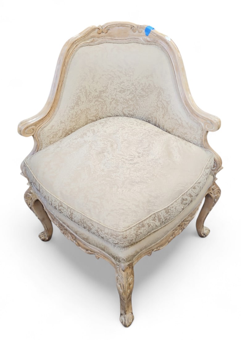 French Carved Upholstered Corner Chair.: The chair has cabriole legs, a removable cushion, and off-white leaf-and-branch upholstery. It is in good, sturdy condition. The piece measures 33" wide, 30" deep, and 36" tall. Third-party freight sh