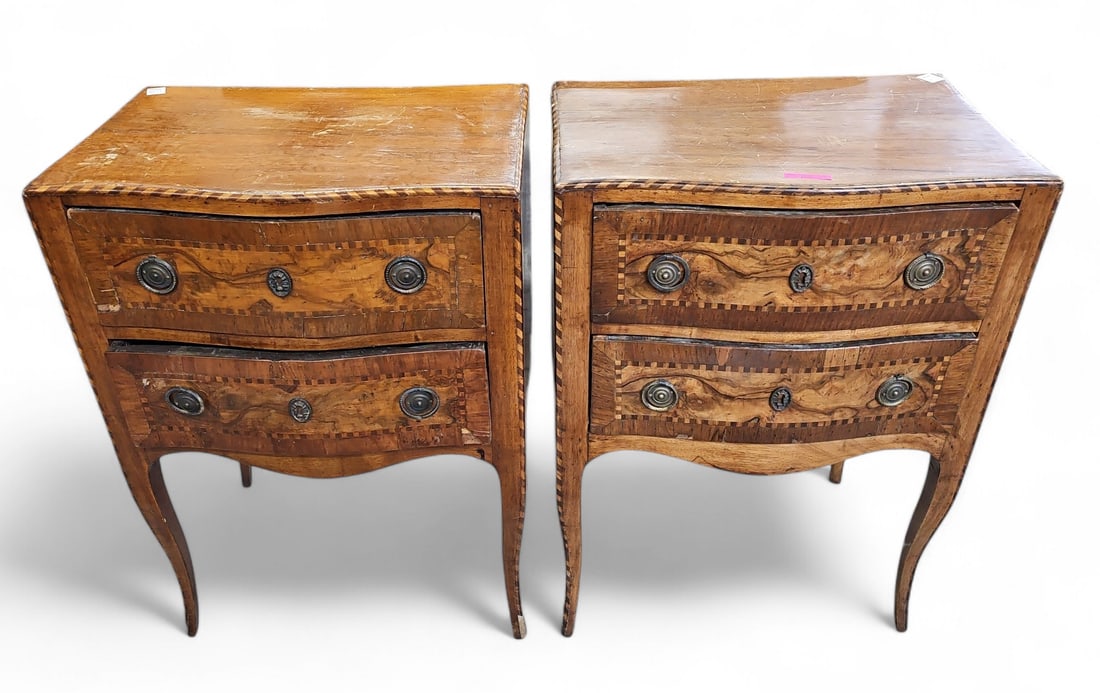 Pair of Inlaid Nightstands.: These burled satinwood (?) Italian style nightstands have roped inlay trimming, two drawers with brass ring pulls, and brass faux keyholes. There are scratches, indentations, scuff marks, and some mis