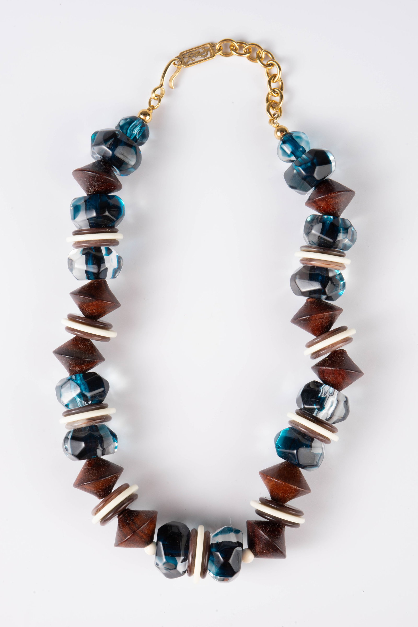 Yves St. Laurent YSL Vintage Wood Lucite Necklace.: This vintage necklace is made up of wood, acrylic, and lucite beads. The piece measures roughly 18" long and up to1" wide. The necklace has some scratches, and one of the wooden beads has 3 small chip