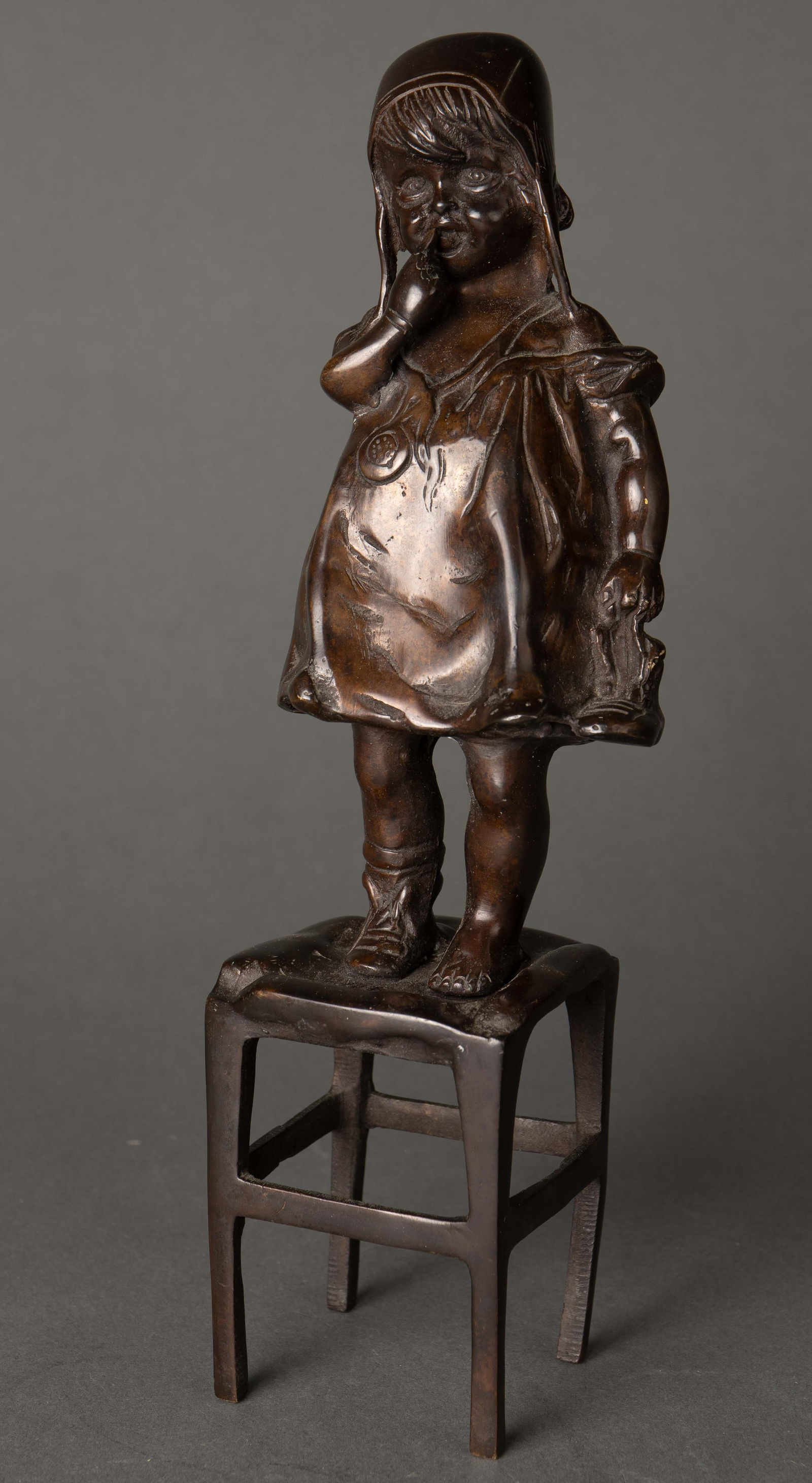 After Juan Clara Bronze Sculpture of Girl on Chair: This patinated bronze sculpture measures 11 1/2" tall, 3 5/8" wide, and 3" deep. It is in overall good condition. In-house shipping is available. Please see our website regarding in-house shipping pro