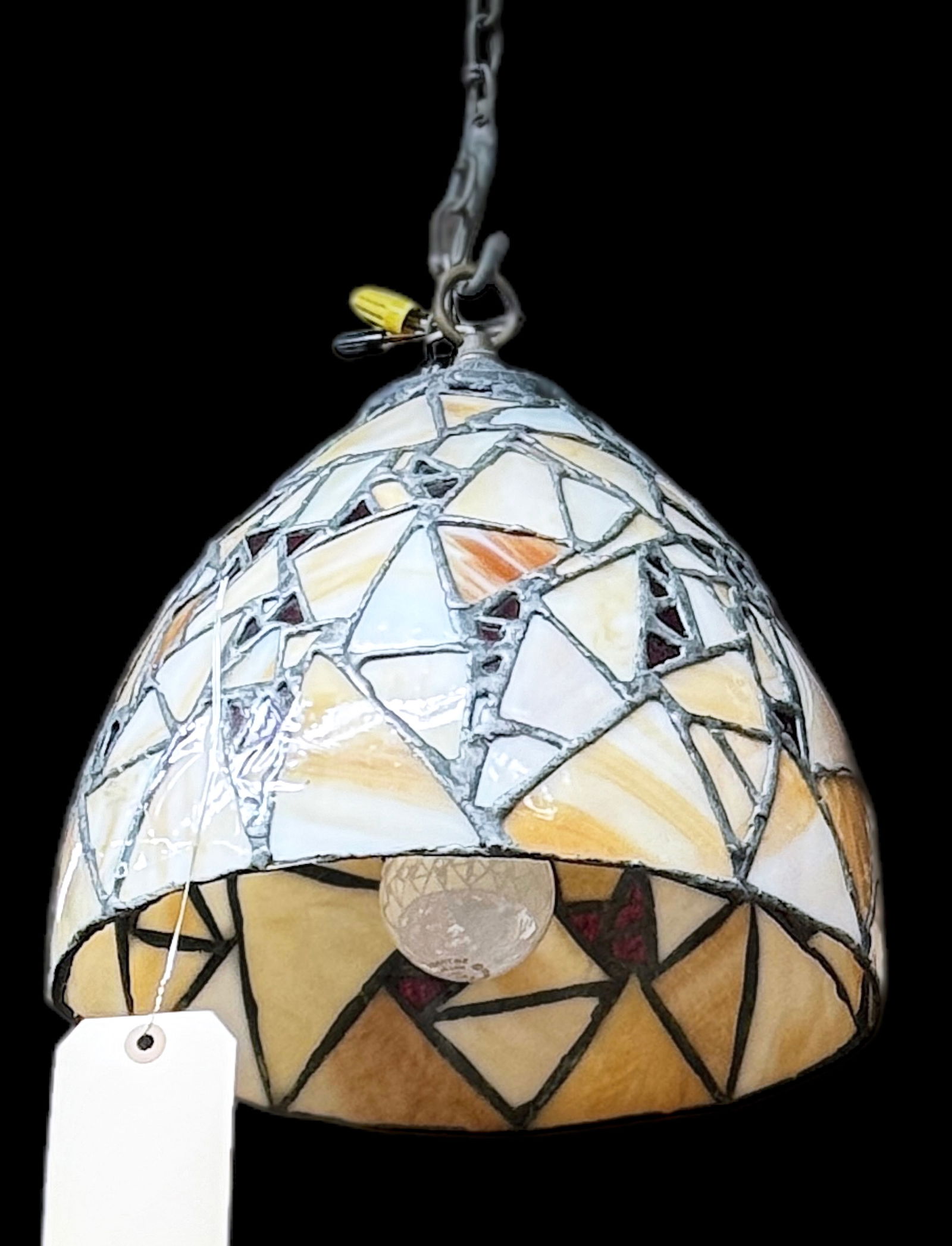Art Deco Leaded Stained Glass Pendant Light.: This hanging shade fixture features beige slag and dark red glass. It measures measures 11" tall, and 11 1/4" in diameter. There is some chipping of the lead, and one of the glass pieces has a superfi