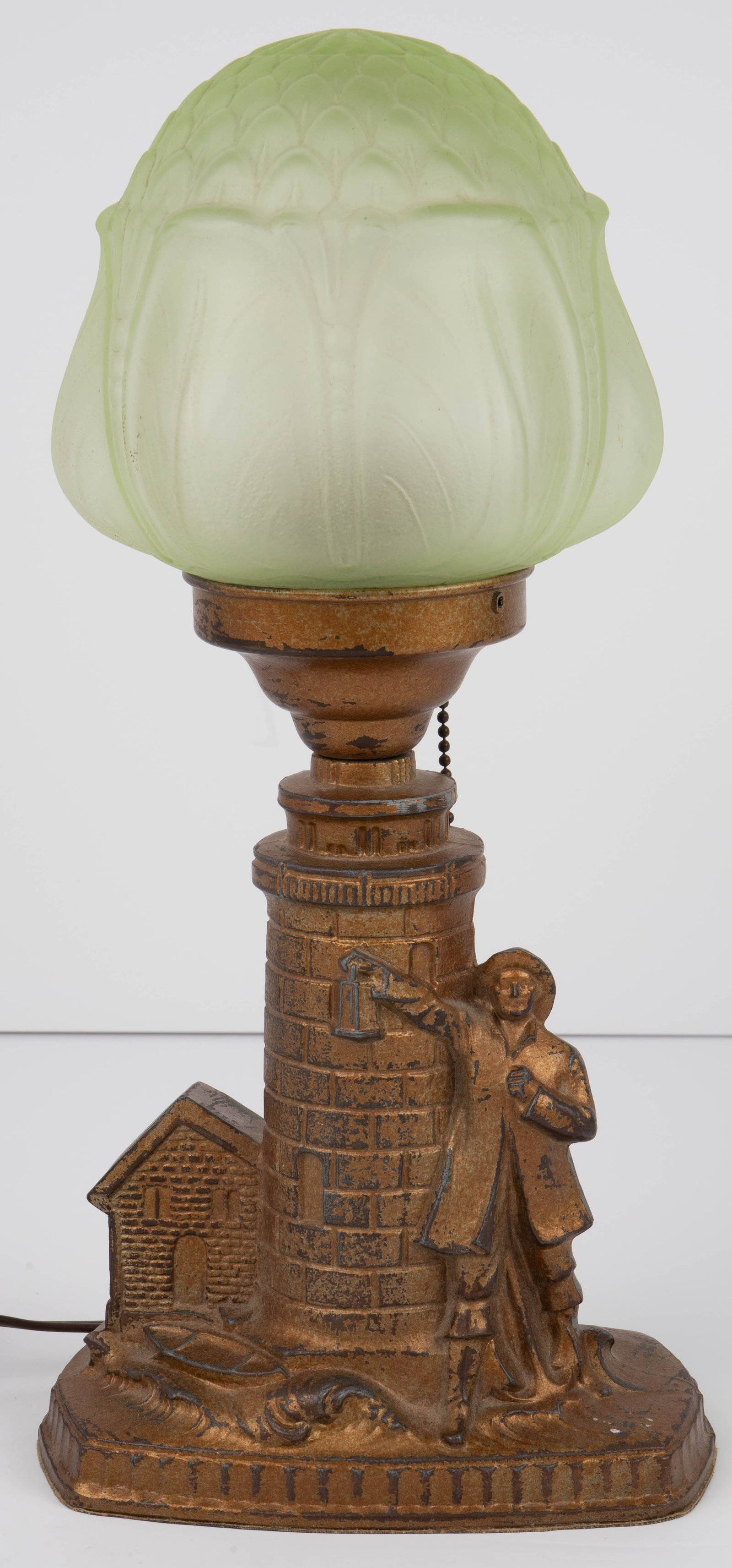 Lighthouse Lamp w/ Art Nouveau Flower Shade.: The base depicts a fisherman holding a lantern by a lighthouse, while waves crash up against his feet. It has a bronze-like appearance, but is painted white metal. The back of the lamp is stamped, "No