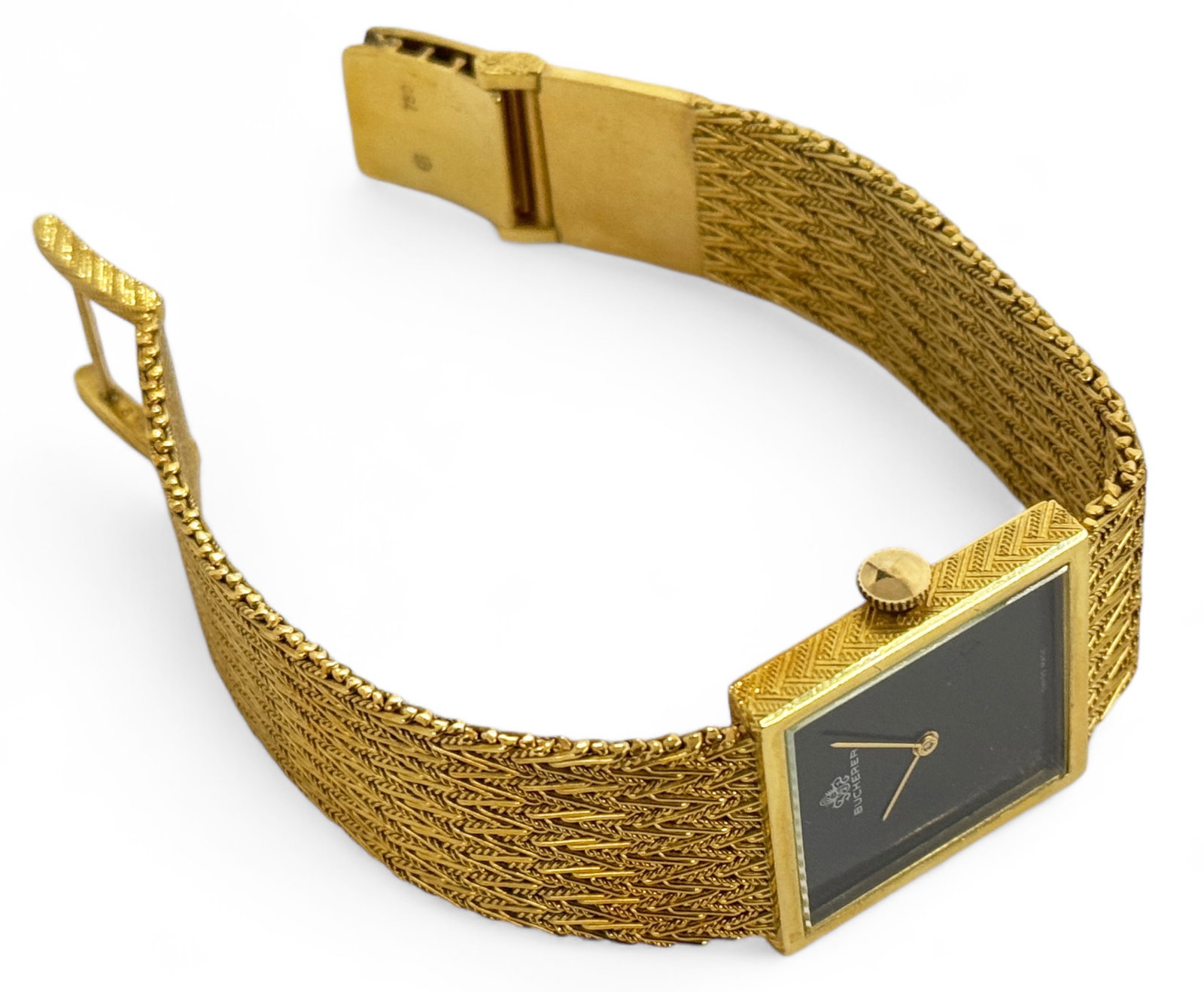 18K Gold Bucherer Vintage Black Dial Watch.: This vintage Swiss made piece is marked 750 on the clasp. It has a square black dial with a 26mm case. the inside of the case is also marked 18K. The band measures up to 7/8" wide. It weighs 54.5 Penn