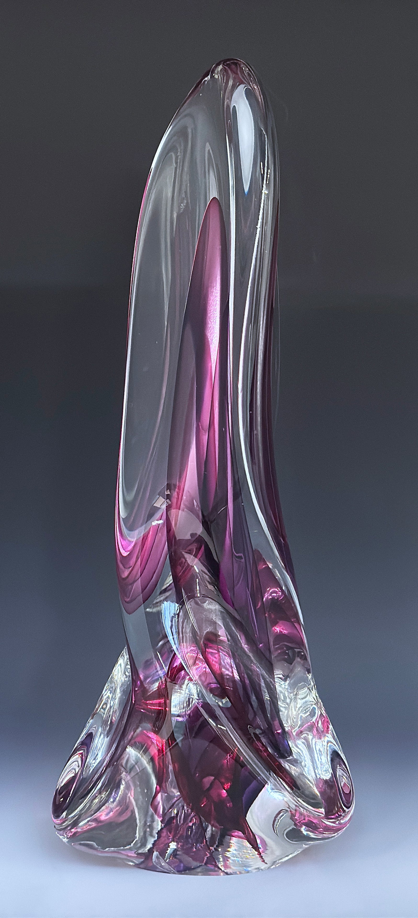 Rollin Karg Signed Freeform Glass Sculpture.: It is signed and dated 2001. It is a fuchsia pink twisted sculpture, in overall good condition. It measures 17 3/4" tall, 7" across the widest area. In-house shipping is available. Please see our webs