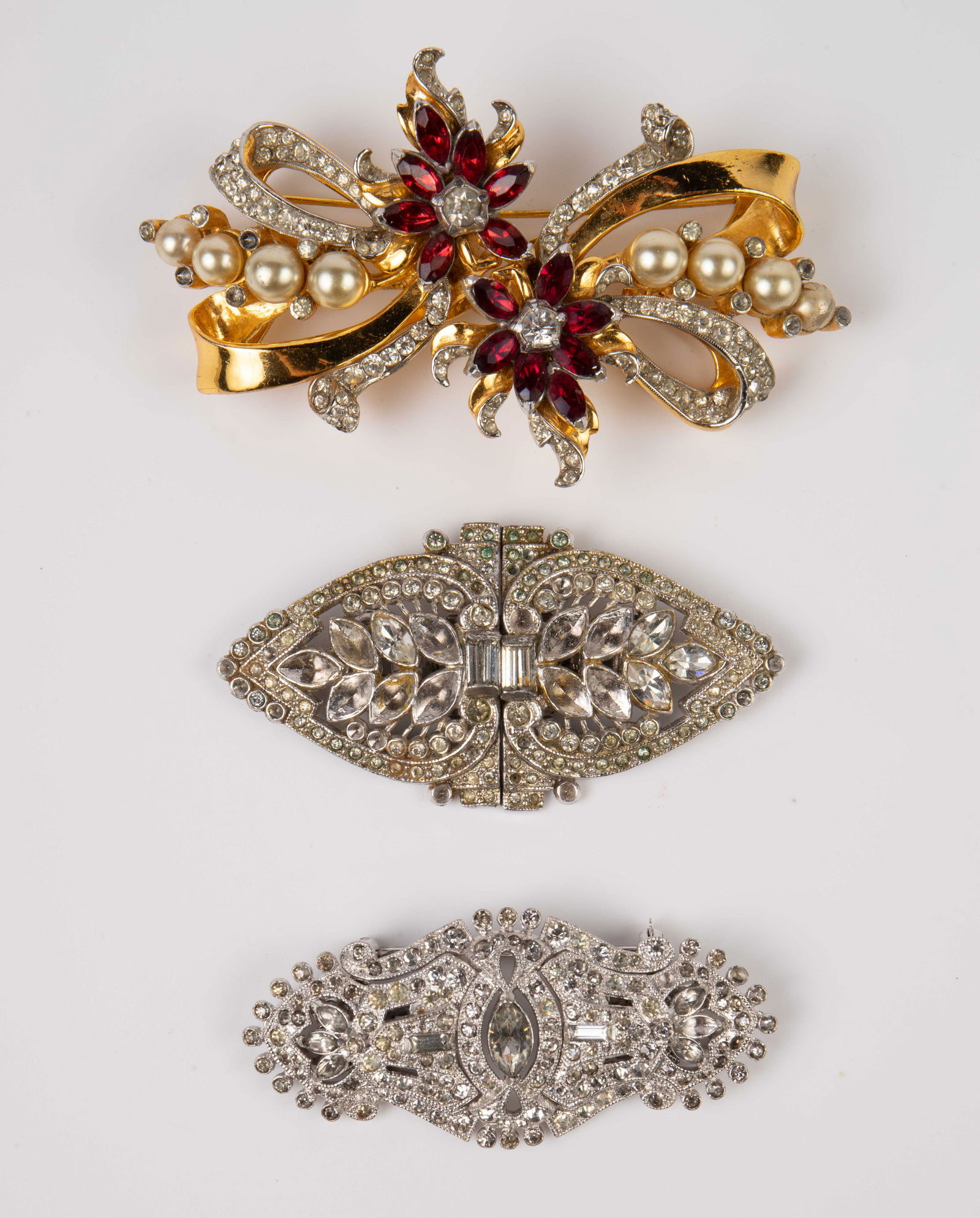 Lot of 3 Coro Duette Brooches - 1 Sterling.: The lot contains 3 vintage brooches by Coro. The smallest piece is marked Coro, while the others are marked Coro Duette. All of the pieces are marked PAT. 1798867. The largest piece is sterling silver