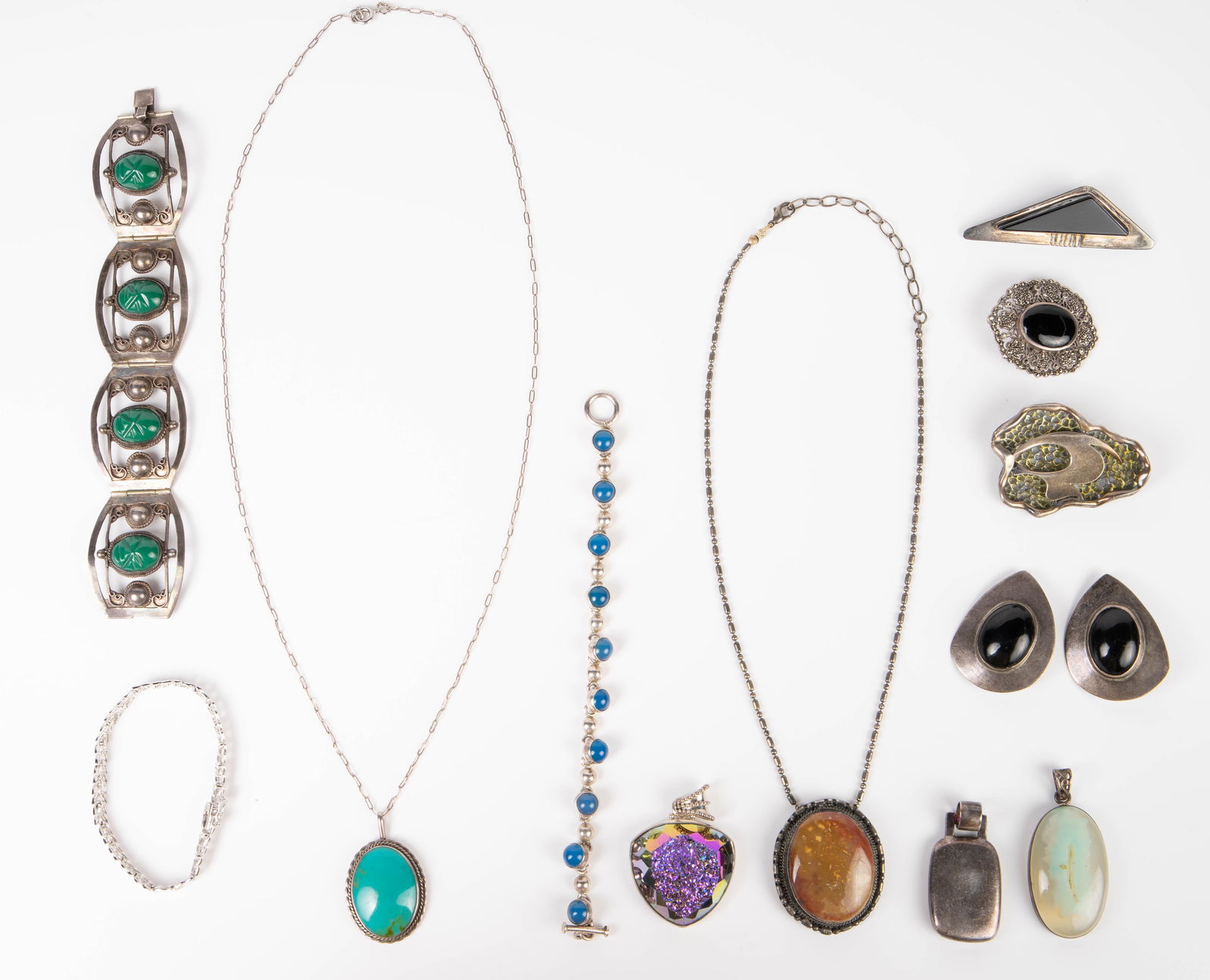 Lot of Sterling Silver Jewelry.: The lot includes bracelets, necklaces, brooches, pendants, and a pair of earrings. Some of the signatures observed are Zina, IN / CL, and Coro. The necklaces range from 18" - 25" in length. The smalle