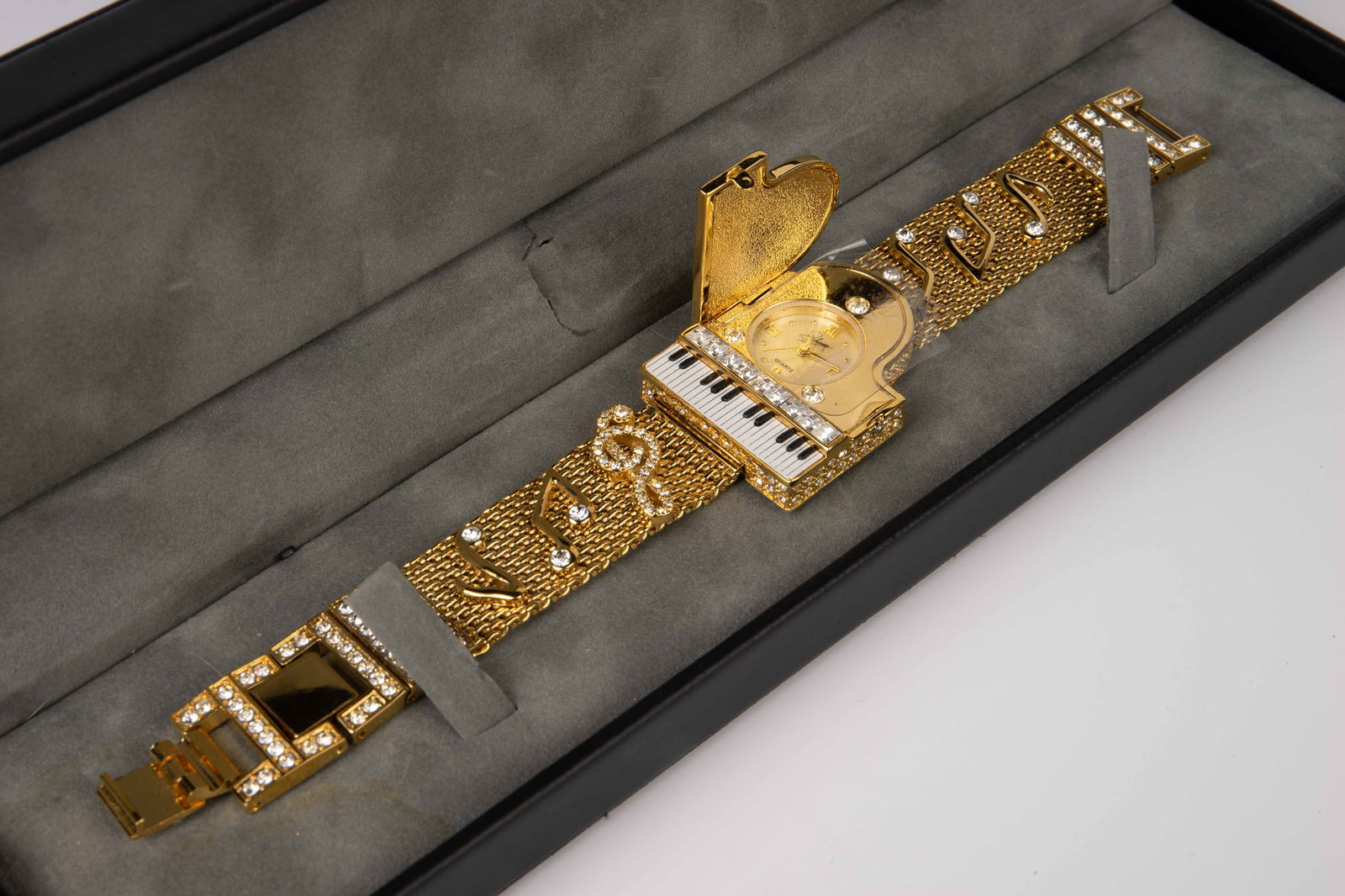 Pedre Watch Co. Liberace Replica Piano Watch.: This limited edition watch is marked 135 - 201 on the back. The lift top case measures 1 1/2" x 1 1/8", and the mother of pearl round face inside is 5/8" in diameter. The watch comes with the original