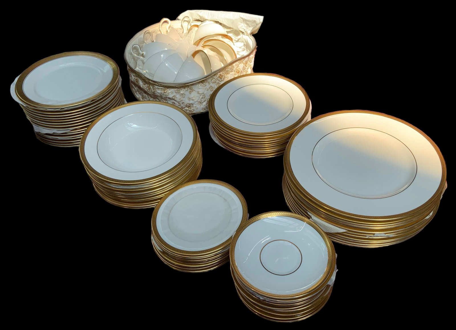 72 Pc. Wedgwood "Senator" Gold Rimmed China Set.: The Wedgwood set includes 12 dinner plates, 12 salad plates, 12 cups, 11 saucers, 12 soup bowls, and 13 bread and butter plates. Also included in the lot are 16 Rosenthal salad plates, in a similar go