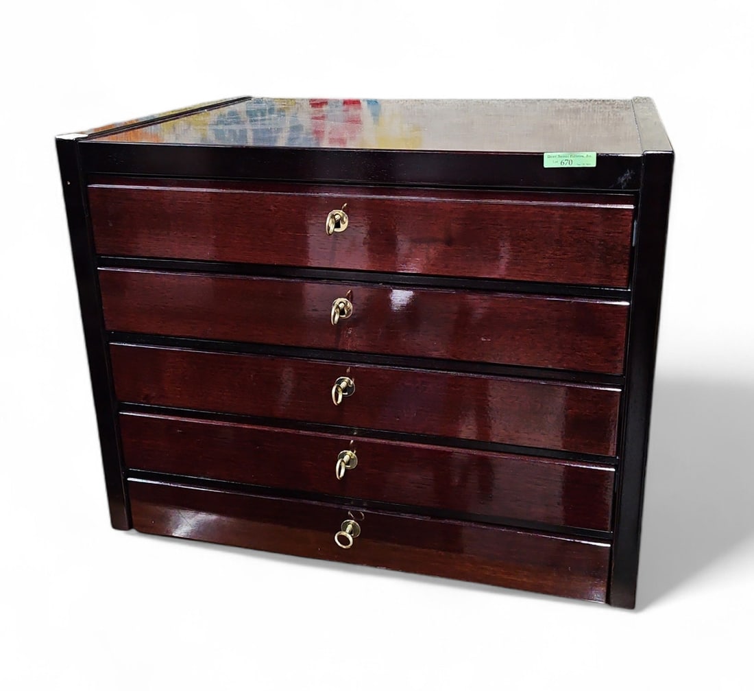 Mahogany Silverware Chest.: This varnished and ebonized chest has five drawers, each with its own key. Every drawer but the bottom drawer has inserts for storing silverware. The piece is in great condition, with only minor wear.