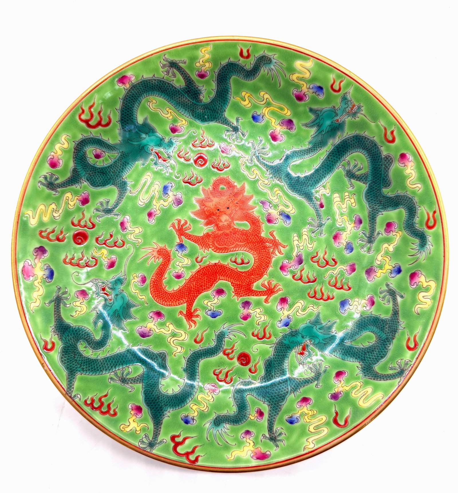 Famille Rose Chinese Porcelain Dragon Plate.: The plate has a mark on its underside, and bat designs on the underside of its rim. It is in good condition. It measures just over 1 1/8" tall, and 8 3/8" in diameter. In-house shipping is available. 
