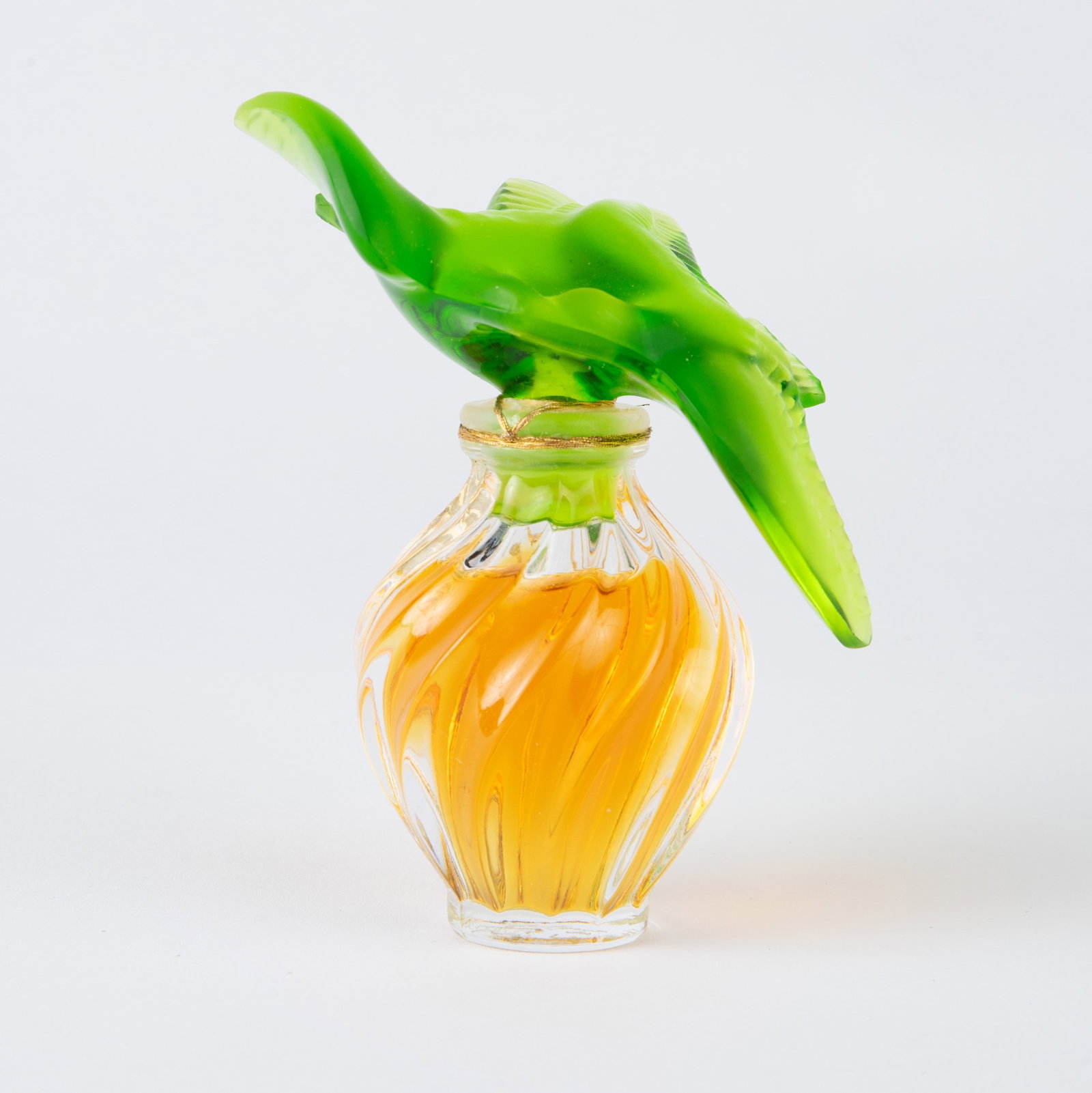 Nina Ricci L'Air Du Temps Perfume Lalique Crystal.: This vintage green glass stopper perfume is marked Nina Ricci France, along with numbers on the underside. The Lalique crystal bottle features a pair of doves, and is signed along the edge of the base