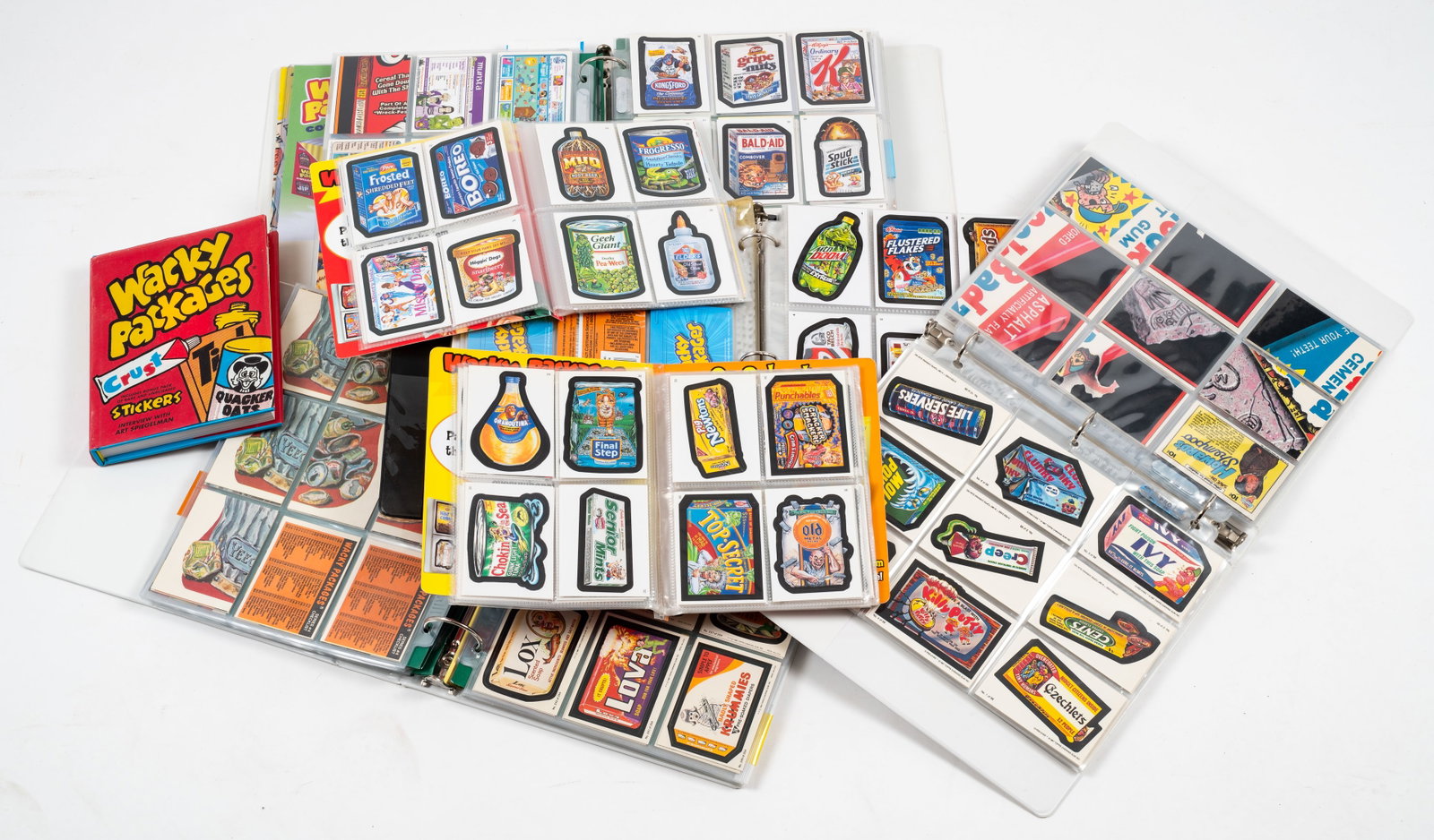 Large Collection of Wacky Packages Stickers.: There are well over 1000 cards in this lot. Included are stickers from the 1970's, 1980's, 1990's, 2000's, and 2010's. They are protected in plastic sleeves, stored in albums and binders. The lot also