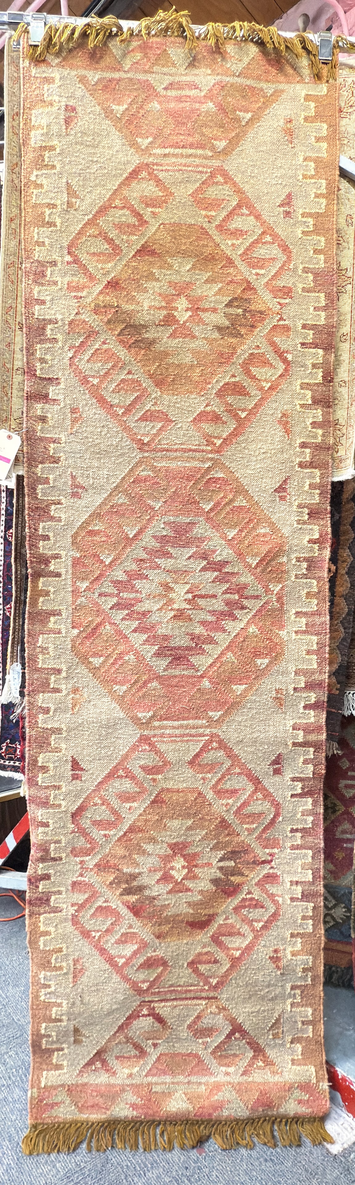 2' 6" x 9' Tan Kelim Runner Rug.: The rug looks to be in good overall condition. In-house shipping is available for this rug. Please see our website about in house shipping procedures.
