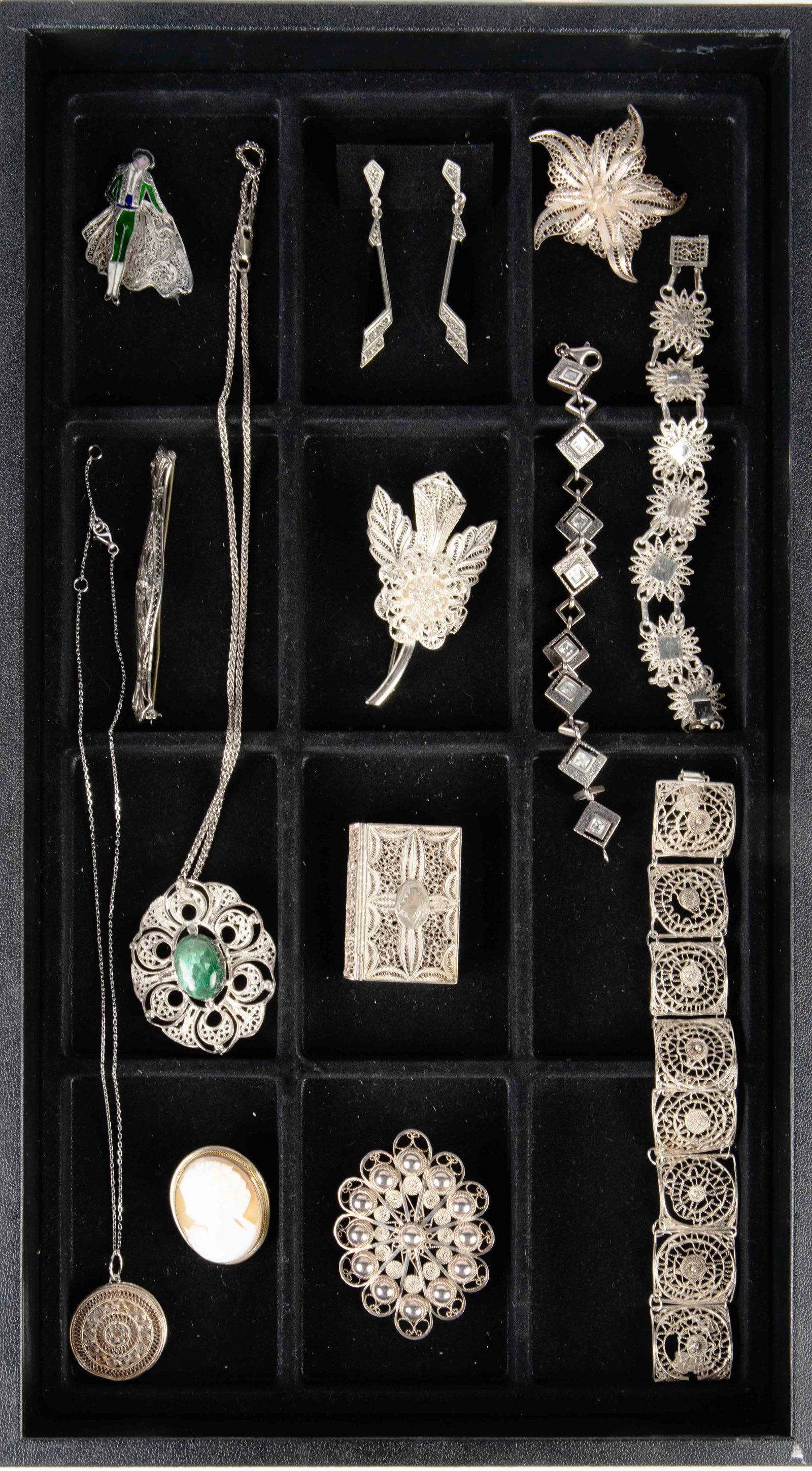 13 Antique / Vintage Sterling Filigree Jewelry Pcs: The lot consists of 2 necklaces, 3 bracelets, 3 brooches, 1 pill box, and 1 pair of earrings. The lot also includes a natural carved cameo brooch, an enameled bullfighter brooch, a bracelet with princ