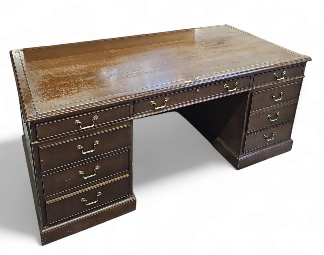 Kittinger Buffalo Executive Desk: This desk features 4 drawers on each side, and one wide central drawer, which is branded on the left side. It measures 30 1/2" tall, 72" wide, and 36" deep. There are some scratches, scuffs, and stain