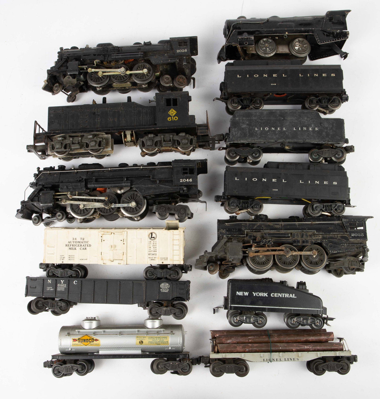 Lot of Vintage Lionel Trains.: This lot includes a 2025 Locomotive, a 2046 Locomotive, a 610 Locomotive, and a 2026 Locomotive. There are three tenders, including a Lionel Lines 2466WX and two Lionel Lines 243W's. There is a 3472 m