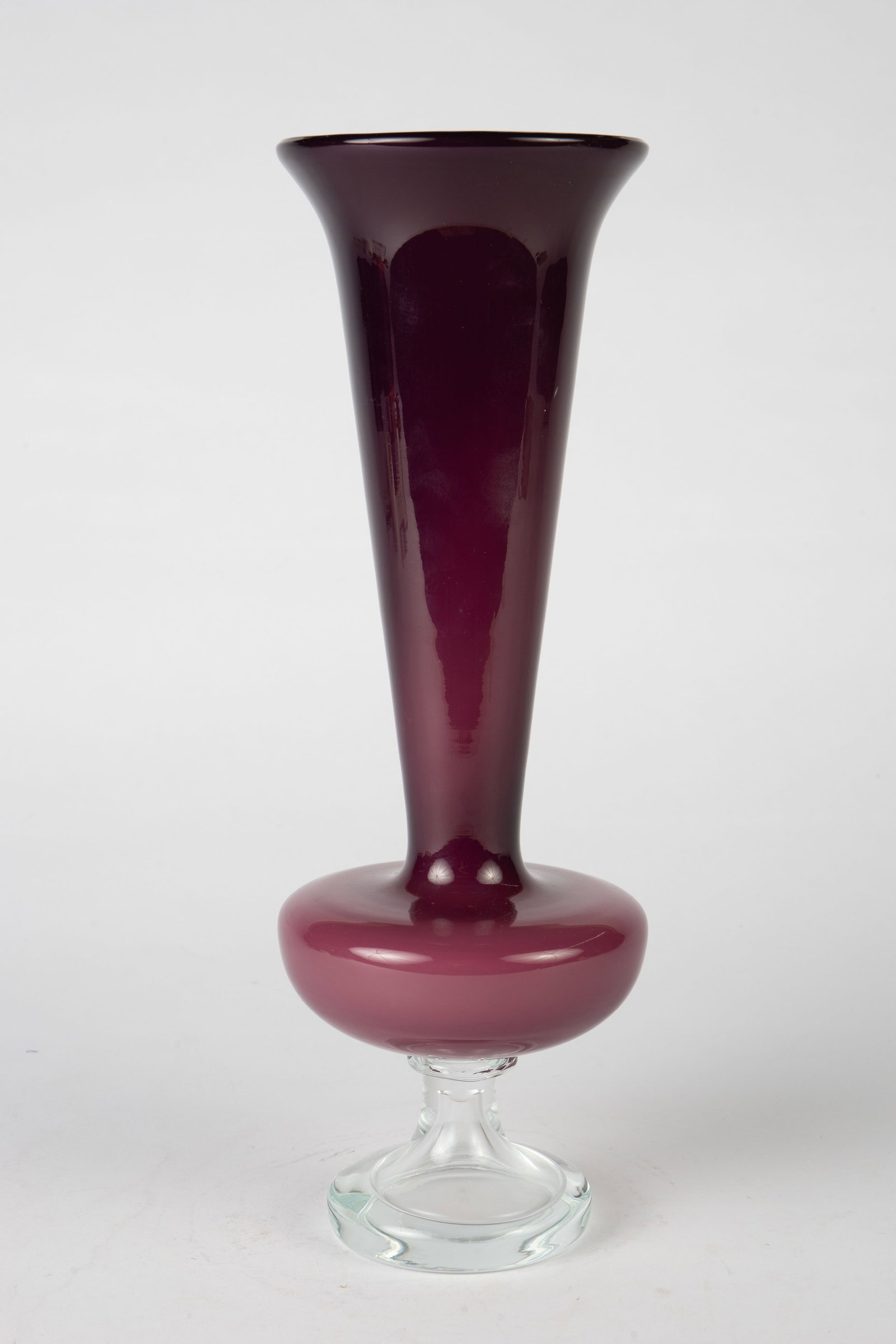 Possibly Murano Glass Amethyst Purple Vase.: This footed vase has a bulbous bowl and a flared rim. It appears to be unsigned, but may be Murano. Overall, it look to be in good condition. It measures 17 3/4" tall, 4 1/2" across the rim. In-house 