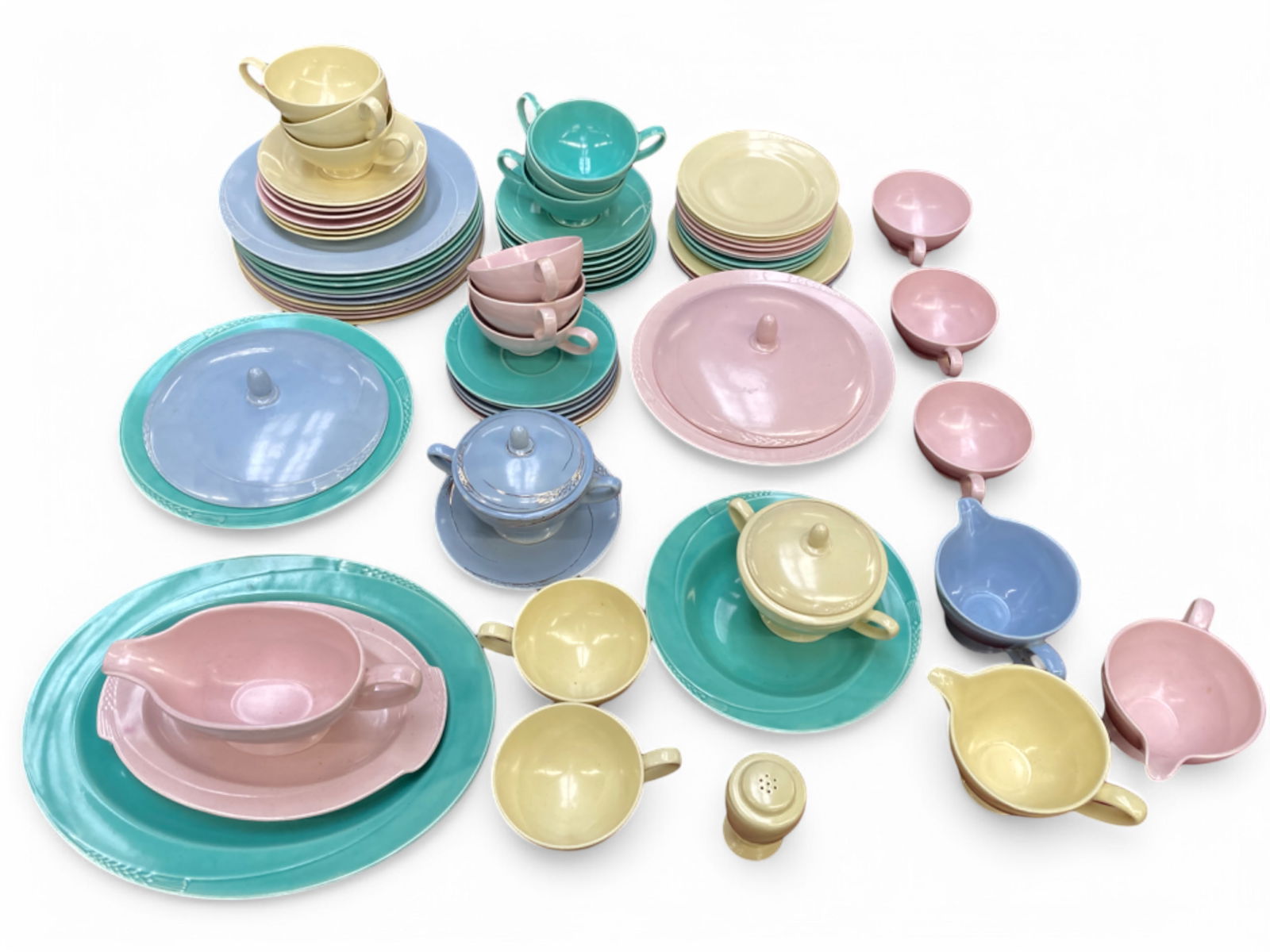 Homer Laughlin Serenade Pastel Color Dinnerware.: The lot includes a total of 66 pieces. They come in the pastel colors pink, green, yellow, and blue. There are 10 dinner plates, 3 salad plates, 9 dessert plates, 1 soup bowl, 20 saucers, 11 coffee cu