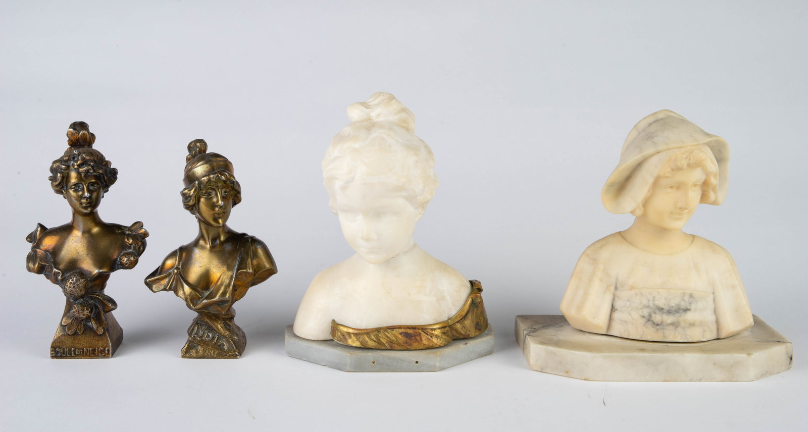 Lot of 4 Female Busts: Marble, Alabaster, Metal.: The two smaller metal busts have a bronzelike appearance. One is titled, "Lydia". The other is titled, "Boule de Neige". The alabaster bust of a young girl has a bronze mount, and has been repaired at