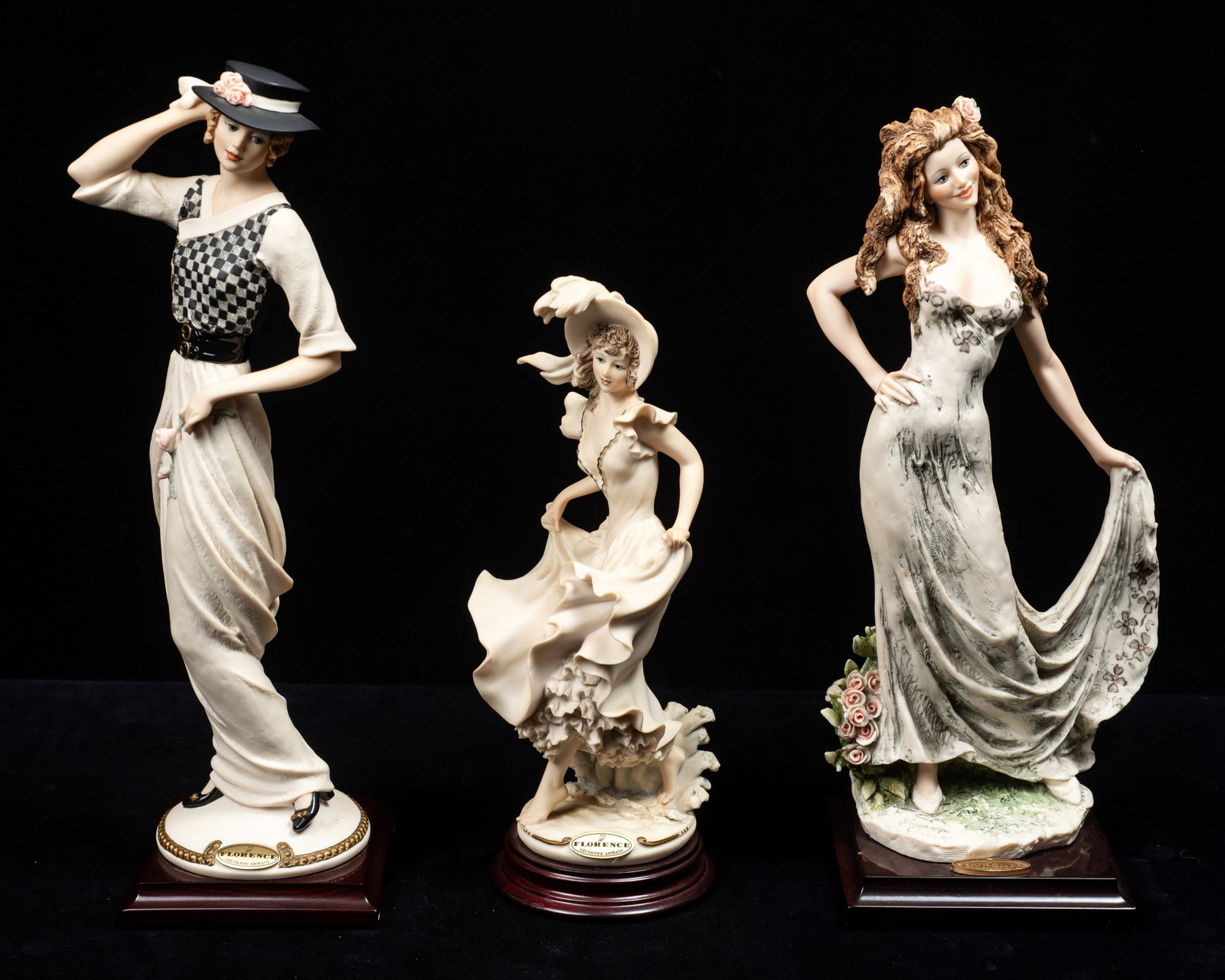 Lot of 3 Armani Lady Figurines.: The lot includes a woman in a black hat ("Kathy"), a woman at the beach, and a "Celebration" figurine with a long dress and a pink rose in her hair. Overall, the lot looks to be in great condition. Th