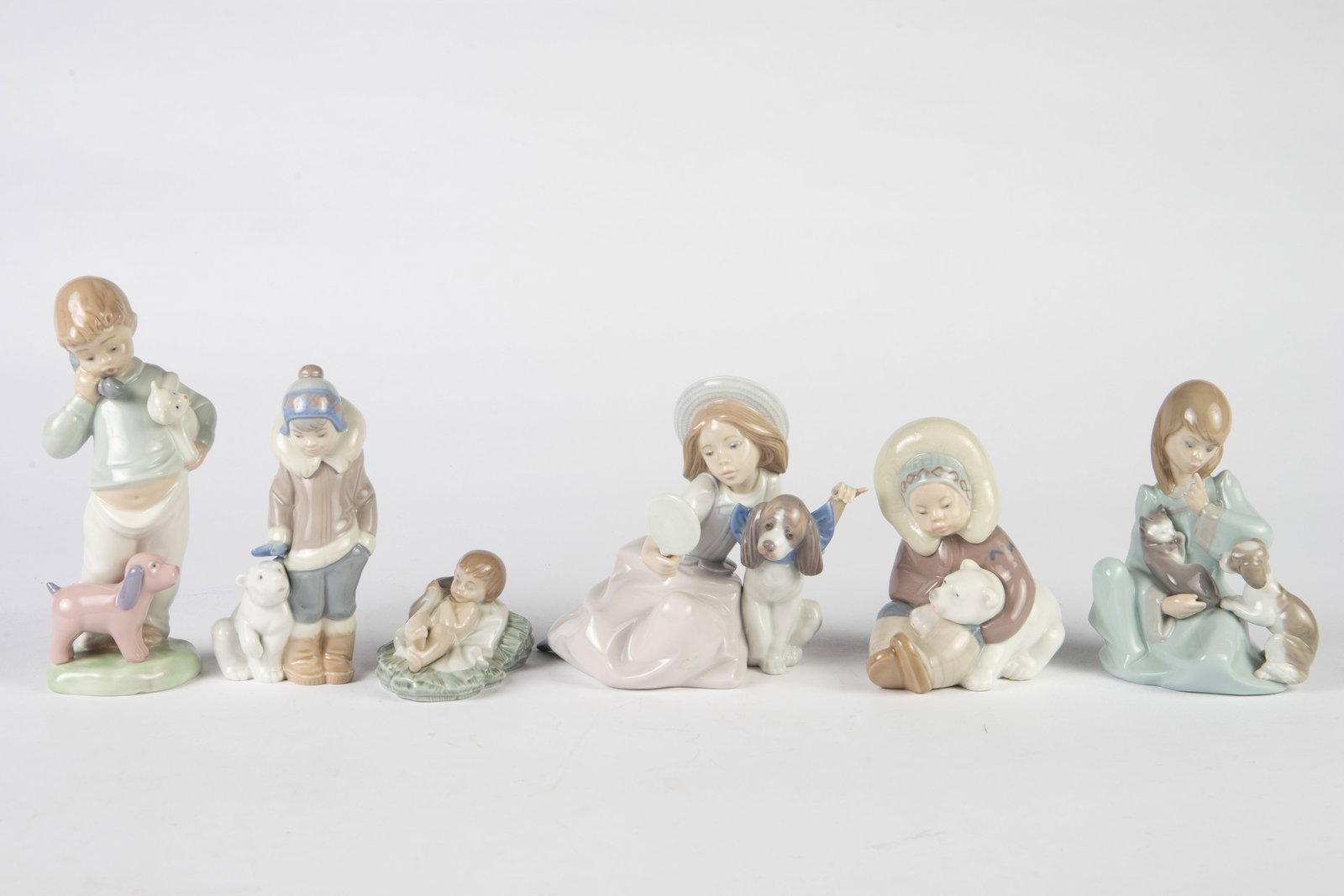 Lot of 6 Mostly Lladro Child Figurines.: They include 5 Lladro figures and one Nao by Lladro figure. The lot looks to be in very good condition. The largest figure measures 7 1/2" tall. In-house shipping is available. Please see our website 