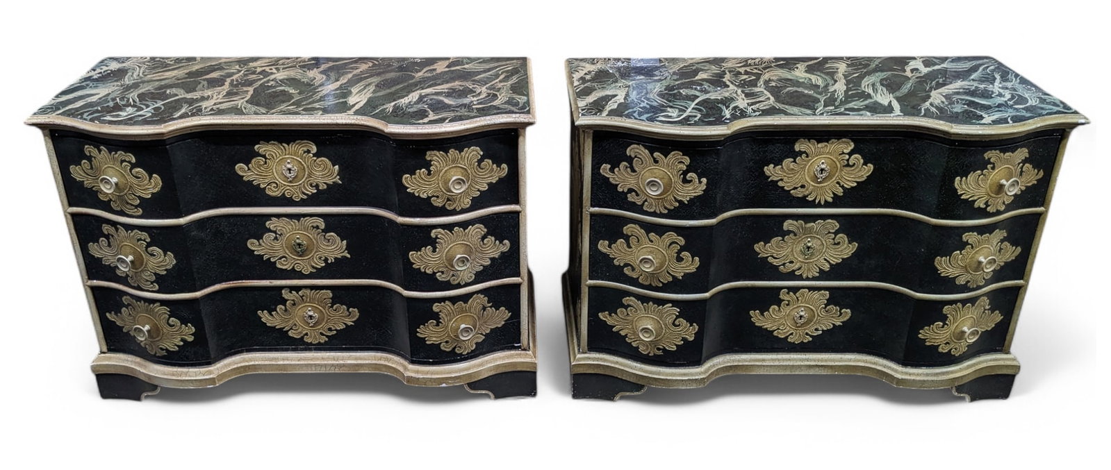 Pair of Baker French Style Painted Chests.: Both of the chests are signed. They are painted and have serpentine fronts with three drawers each. The drawers have metal pulls and decorative escutcheons. The tops of both of the chests have surface