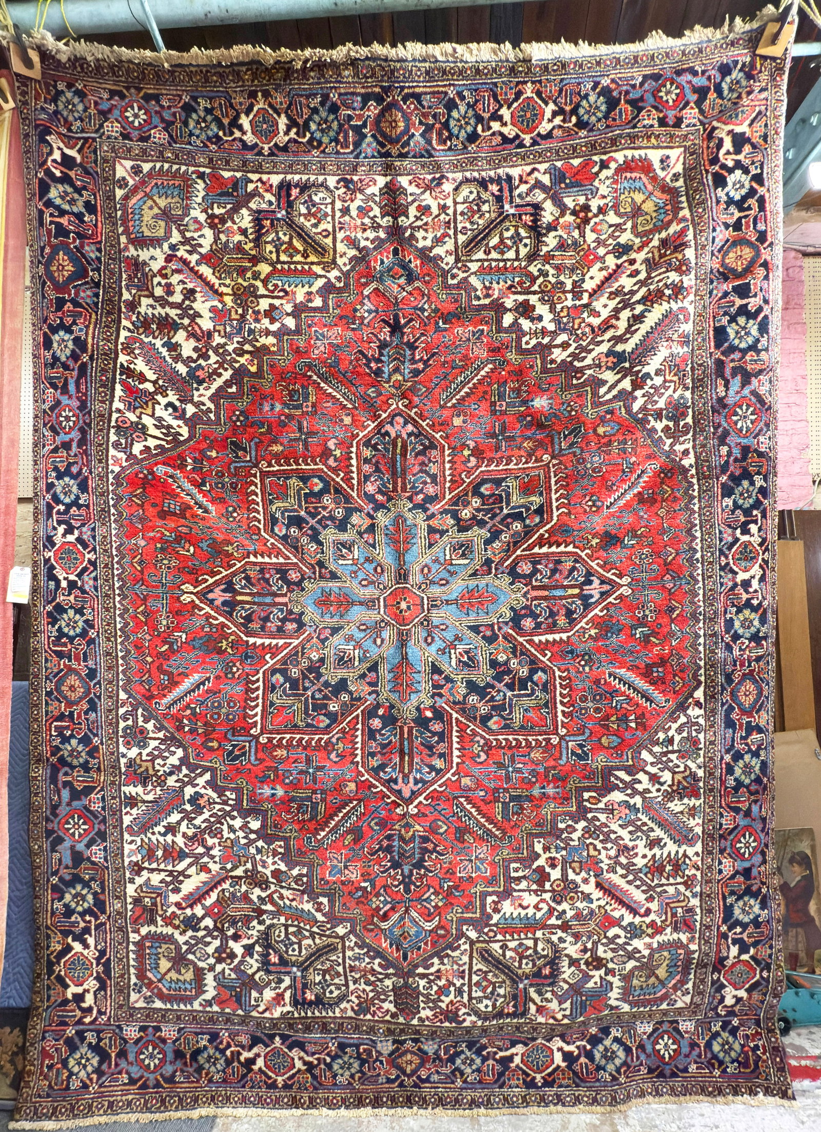 9' x 11' 10" Persian Heriz Rug.: The rug has a stain, upper left. It has rich colors, and has a striking look. In-house shipping is available for this rug. Please see our website about in house shipping procedures.