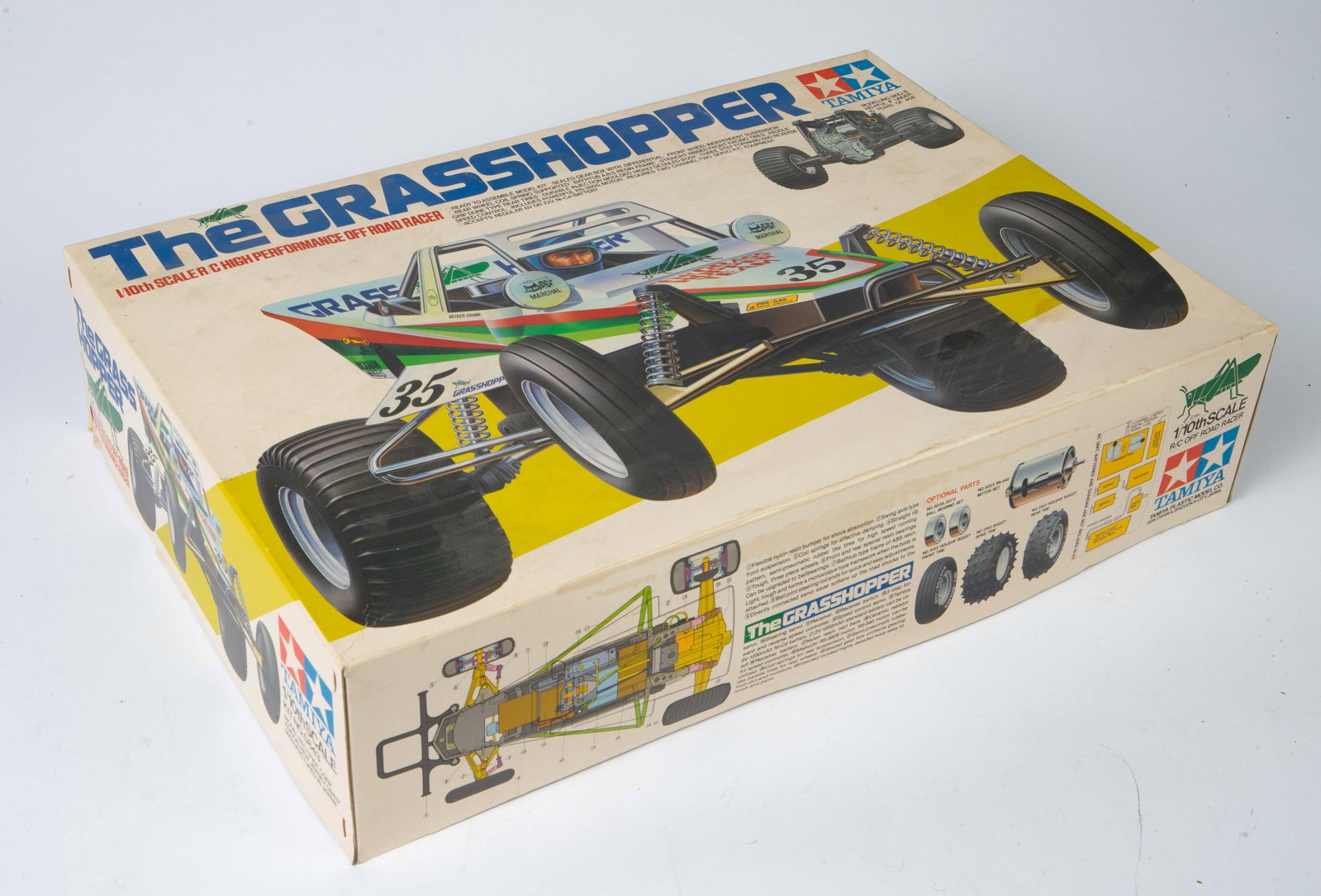 Tamiya "The Grasshopper" Off Road Racer.: The box is no longer sealed, though the contents look to be unused. The dimensions of the box are 19 1/8" x 13 1/8" x 4 5/8". The box exterior has some minor signs of wear, but looks to be in overall 