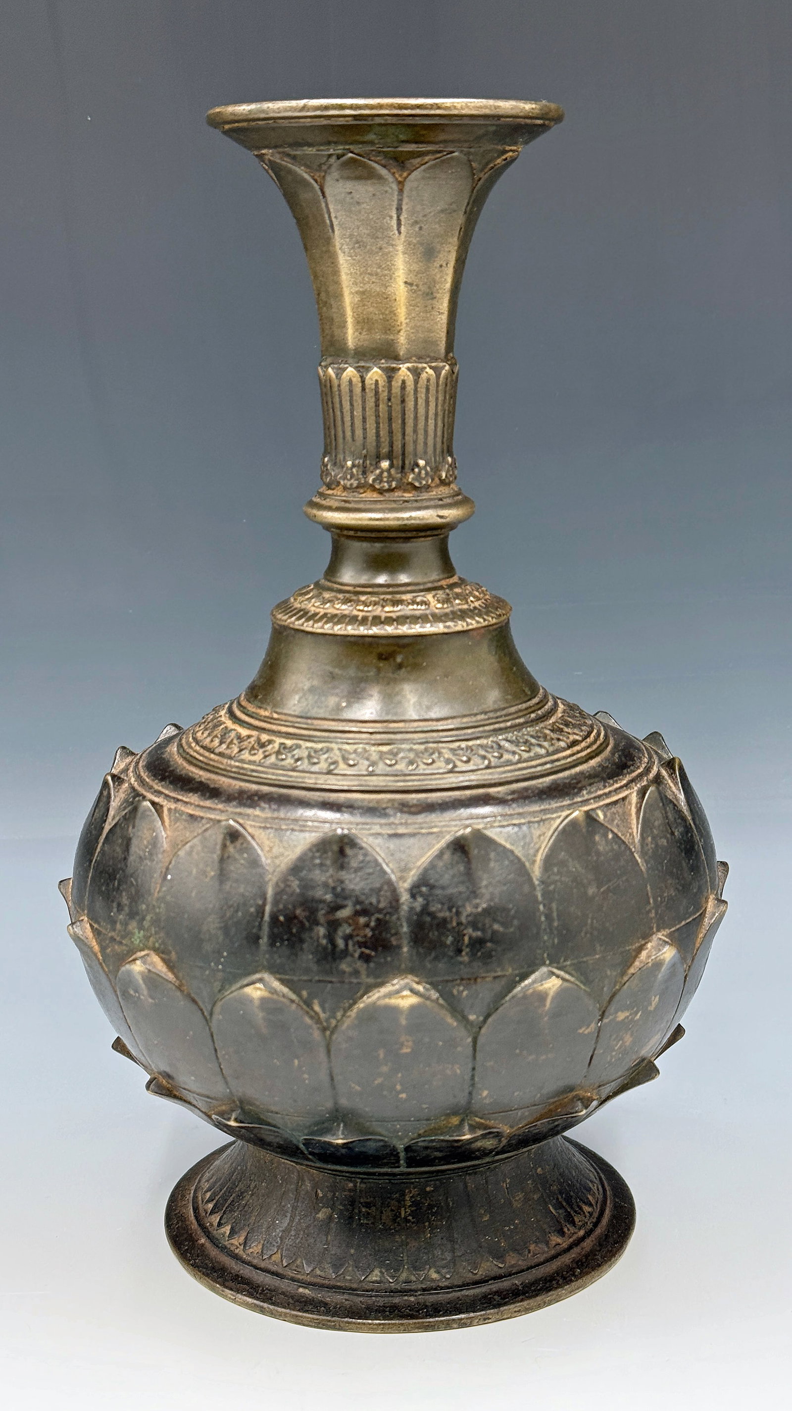 Antique Nepalese Bronze Lotus Shape Vase.: The vase looks to be in good overall condition for its age. It measures 10" tall and 6 1/2" in diameter at its widest point. In-house shipping is available. Please see our website regarding in-house s