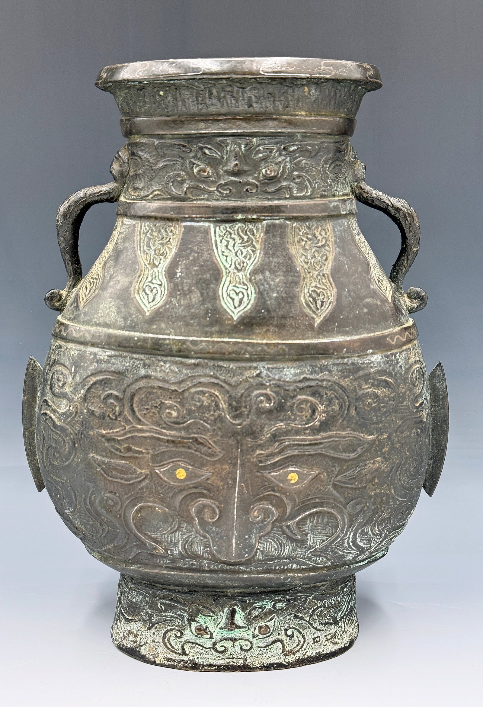 Chinese Archaic Bronze Hu Vase w/ Taotie Masks.: This 19th / 20th Century vase looks to be in good overall condition, with wear to use. It measures 10 1/4" tall, 8" wide, and 4" deep. In-house shipping is available. Please see our website regarding 