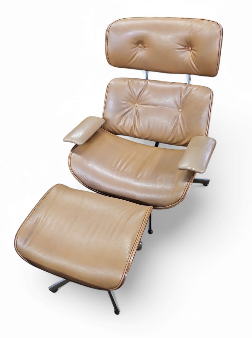 Vintage Plycraft Eames Lounge Chair & Ottoman.: This vintage Eames style brown leather recliner and ottoman was manufactured by Plycraft. The recliner has a button tufted back walnut wood grain, tilt and swivel base, and rubber toe caps. The matchi