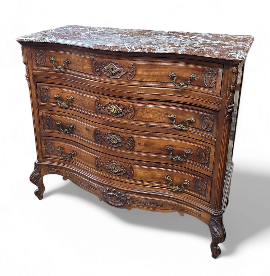 Antique French Marble Top Commode or Chest.: This commode or chest of drawers features four serpentine drawers, brass decorated hardware, carved legs, and panelled sides. It is in very good condition, with only minor scratches. The piece measure